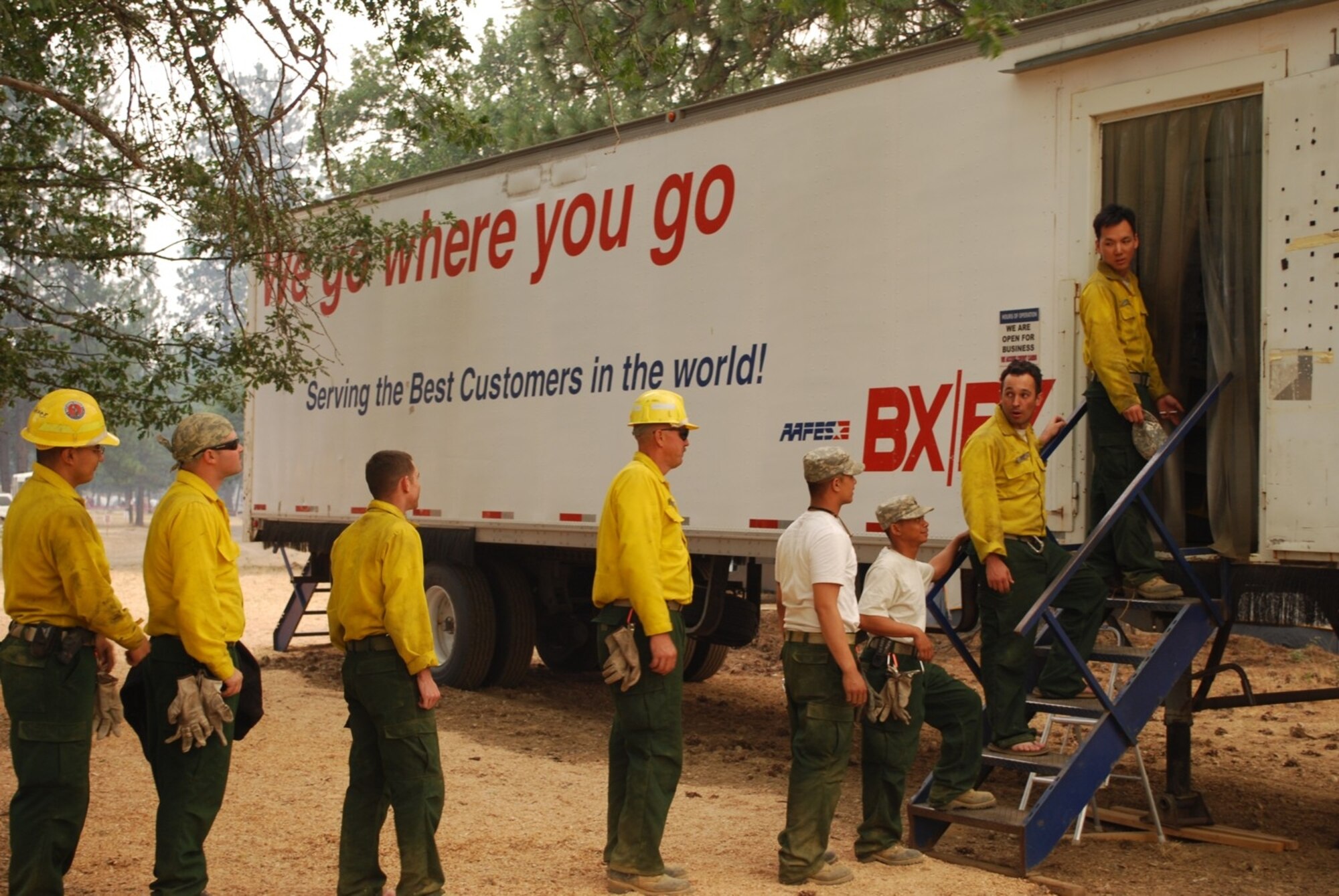 California firefighters and National Gurad members file into a Mobile Field Exchange in Northern California recently. Members of the Army and Air Force Exchange Services deployed from Travis and Beale Air Force bases in support of personnel fighting wildfires. (U.S. Air Force photo)