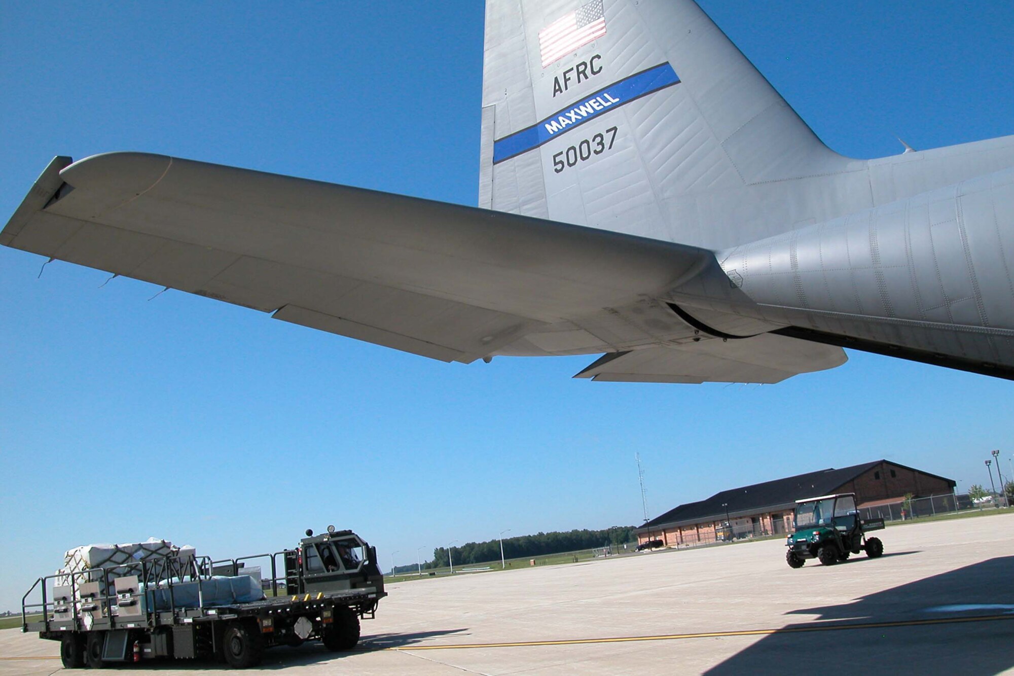 GRISSOM AIR RESERVE BASE, Ind., -- Air transportation specialists from Grissom's 49th Aerial Port Flight practice specialized cargo loading using a Halverson aircraft loader during a unit training assembly.  The training was done with the help of a C-130 cargo aircraft from the 357th Airlift Squadron at Maxwell AFB, Ala.  (U.S. Air Force photo/Staff Sgt. Chris Bolen)