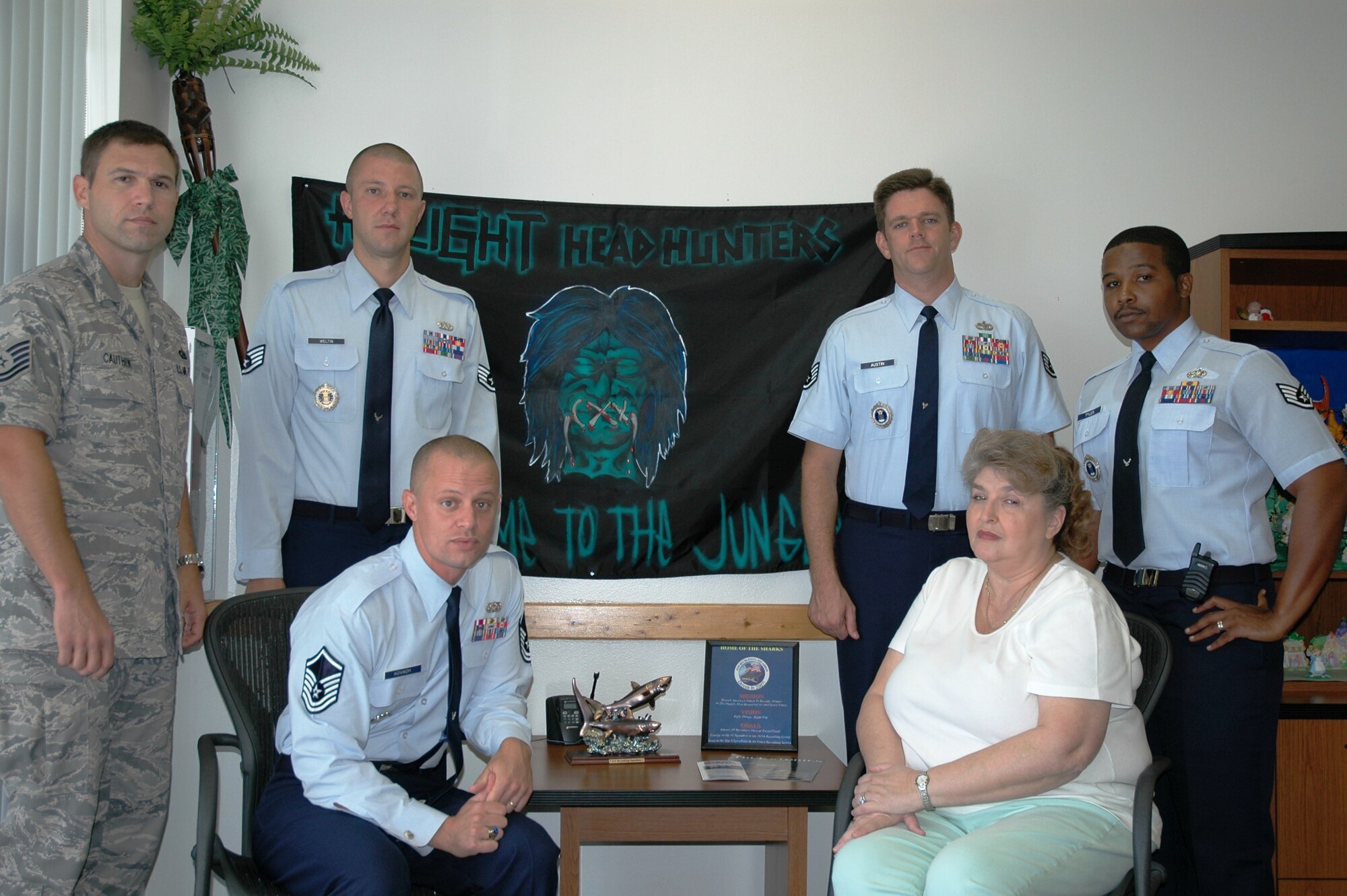 Master Sgt. Michael Kovach, bottom left, flight chief for H Flight, 333rd Recruiting Squadron was recently named “Top Flight Chief” within all of U.S. Air Force Recruiting Service for the second quarter. But he’s most proud that his team of recruiters have been ranked No. 1 in the nation for the past 25 weeks in a row. Team members include (left to right) Tech. Sgt. Charlie Cauthen, Staff Sgt. James Weltin, an Outstanding Airman of the Year selectee, Staff Sgt. Coby Austin and Staff Sgt. Alpha Tyler.  Ms. Kathleen Karpinski is the flight secretary. (U.S. Air Force photo by Chris Calkins)