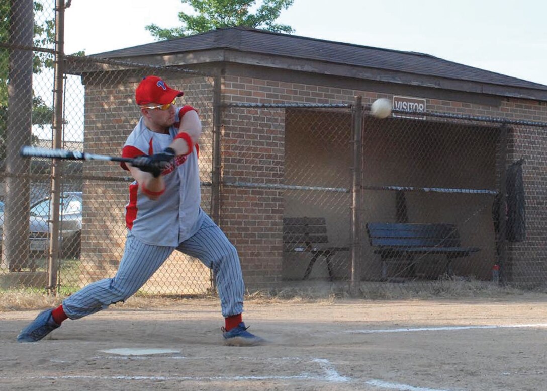 Staff Sgt. Brian Rupp, 89th Aerial Port Squadron passenger service supervisor, swings for a ball at the softball field Monday, Aug. 4. (U.S. Air Force photo by Airman Katie L. Justen)
