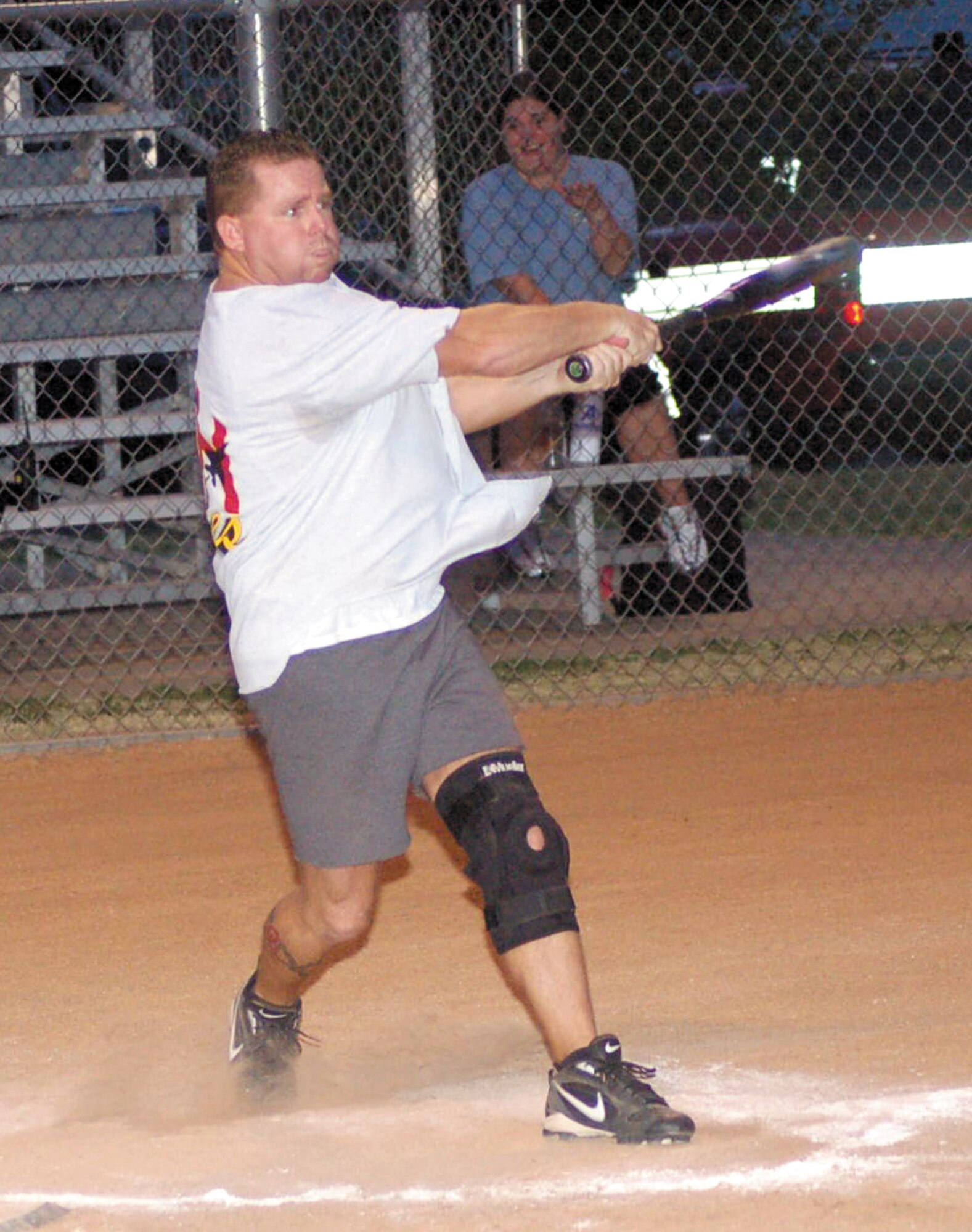 Okies third baseman Brian Finley takes a big cut during the third inning of a July 29 intramural softball game against the Fire Department. The Okies swept the doubleheader 15-0 and 13-4.(Air Force photo/John Banks)