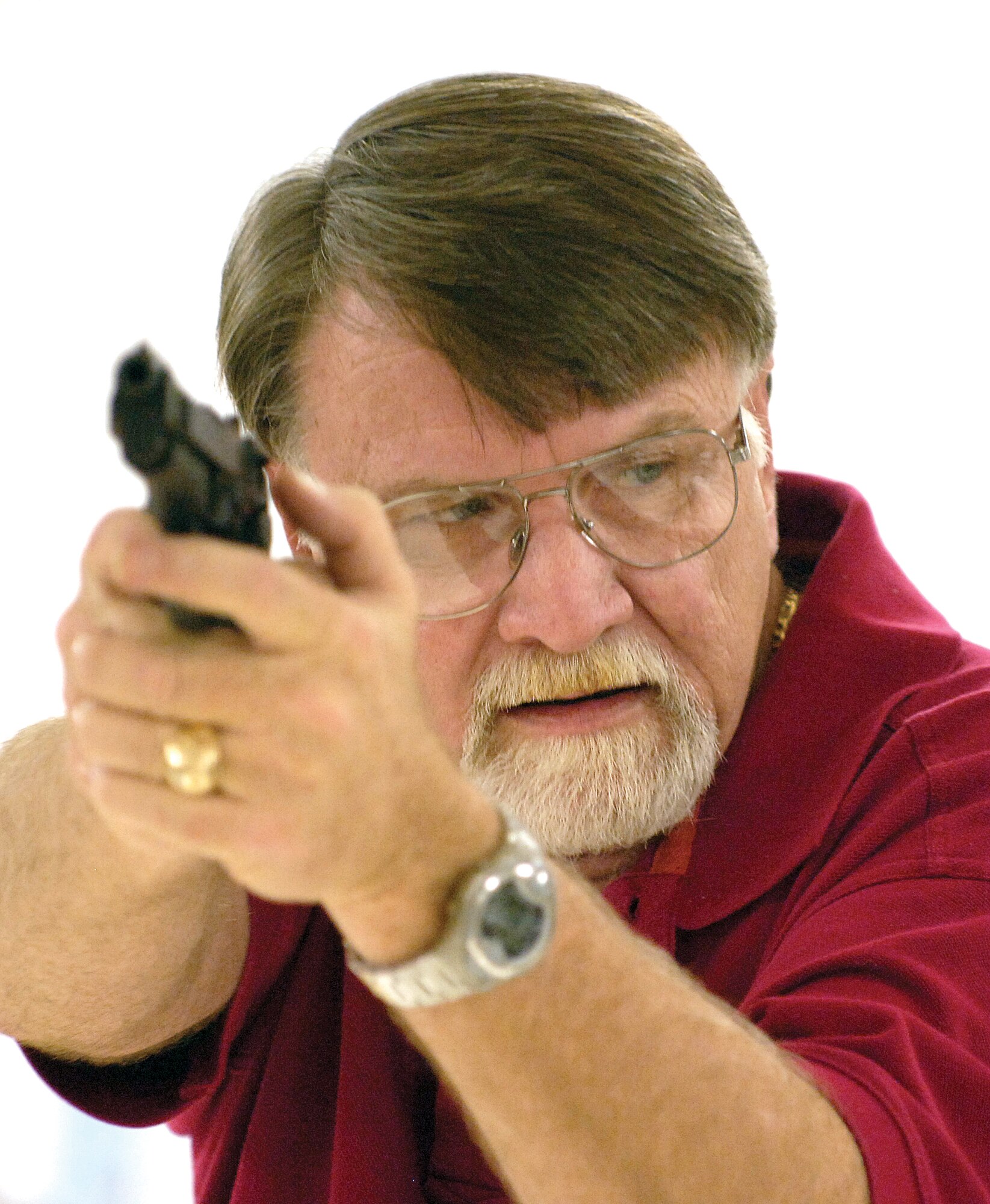 Instructor Marc Benedict teaches every aspect about an M9 pistol in a recent class held in the 72nd Security Forces Squadron’s Combat Arms facility. Airmen, Sailors and Civilians preparing for deployment, along with all security forces personnel, will spend time in the facility’s various classes or at their firing range.(Air Force photo/Margo Wright)