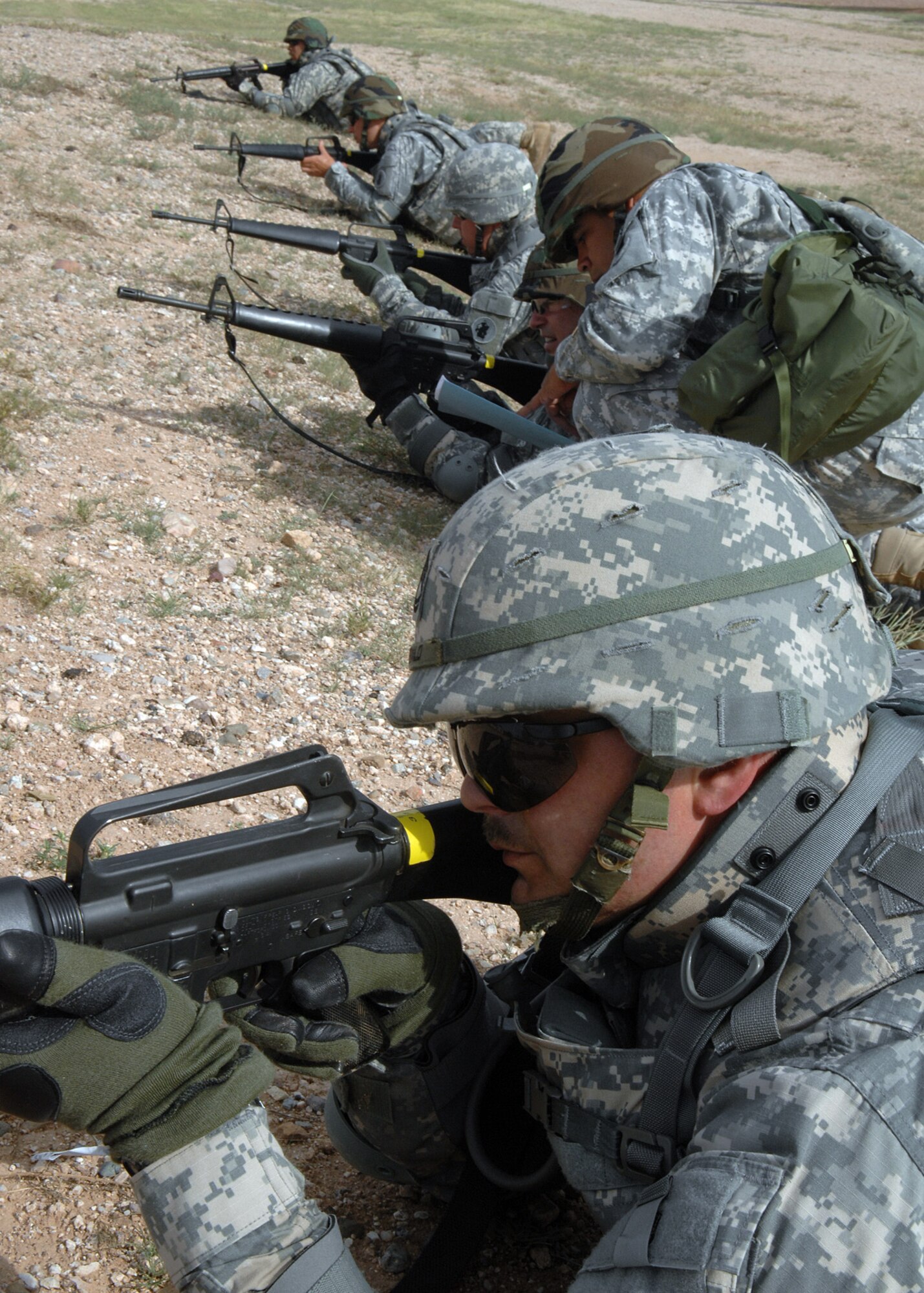 Members of the 1st Battlefield Coordination Detachment eyes on the enemy during a training exercise here Aug. 5. The soldier’s trained together to meet their annual Army training requirements. Some of the requirements are low crawl, high crawl, movement techniques and a hostage situation.  The Army soldiers are a part of the 612th Combined Air Operation Center.  (U.S. Air Force Photo by Senior Airman Jacqueline Romero)