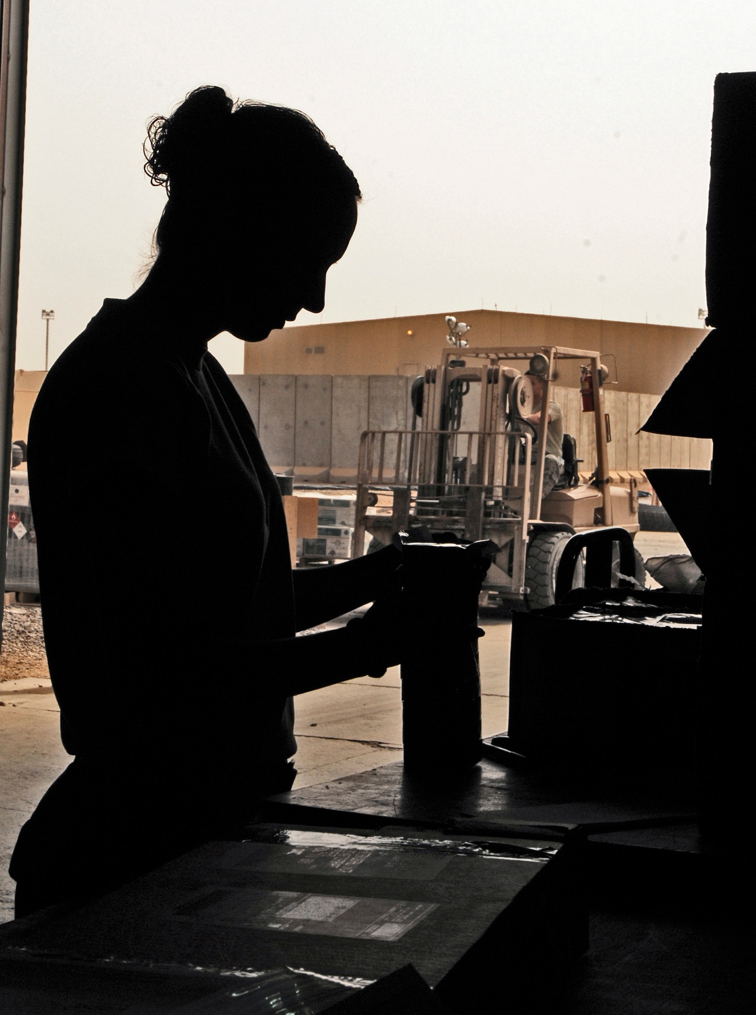 Airman 1st Class Danielle Connelly checks in aircraft parts and supplies Aug. 5 at Joint Base Balad, Iraq. The 332nd Expeditionary Logistics Readiness Squadron's Receiving Flight Service Center Airmen process approximately 350 aircraft parts a week, including broken parts and replacements, which they ship to recipients across the base. Airman Connelly, a flight service center journeyman assigned to the 332nd ELRS, is deployed from Davis-Monthan Air Force Base, Ariz. Her hometown is Alamogordo, N.M. (U.S. Air Force photo/Airman 1st Class Jason Epley) 
