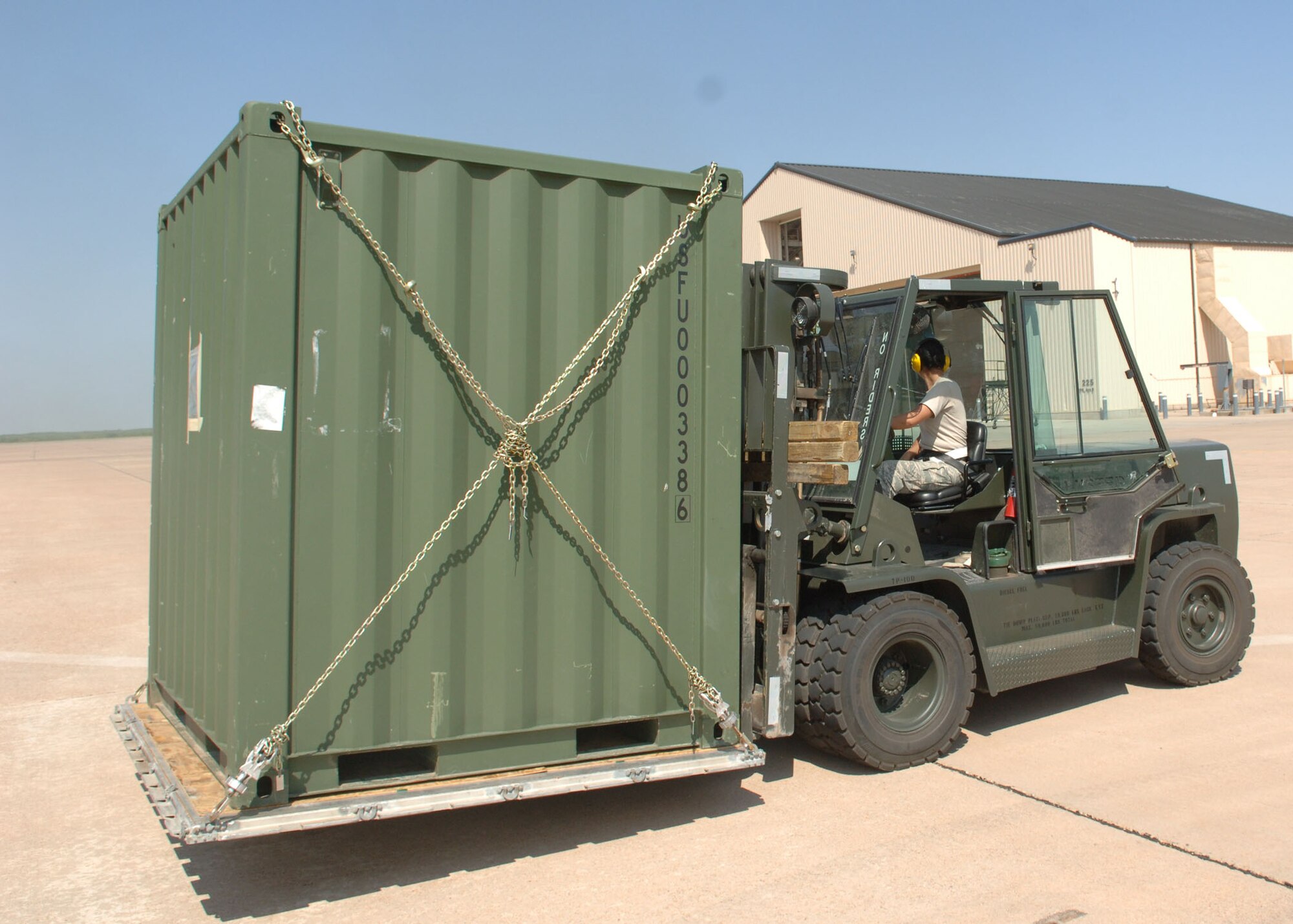 DYESS AIR FORCE BASE, TEXAS -- Senior Noel Brown backs up a forklift carrying cargo during a Cargo Rodeo, July 30. Cargo Rodeo operations are conducted to ensure Airmen have adequate training while deployed in theater. (U.S. Air Force Photo by Airman 1st Class Micheal Breaux).