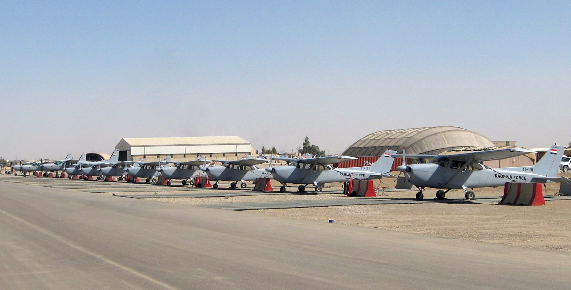 Cessna 172 Skyhawks and 208 Caravans used by U.S. Air Force and Iraqi air force instructor pilots to train Iraqi students at Kirkuk, Iraq. Vance AFB IPs are participating in the rebuilding of the Iraqi air force training program. Less than a year ago there were no aircraft available for training at Kirkuk. (U.S. Air Force photo)