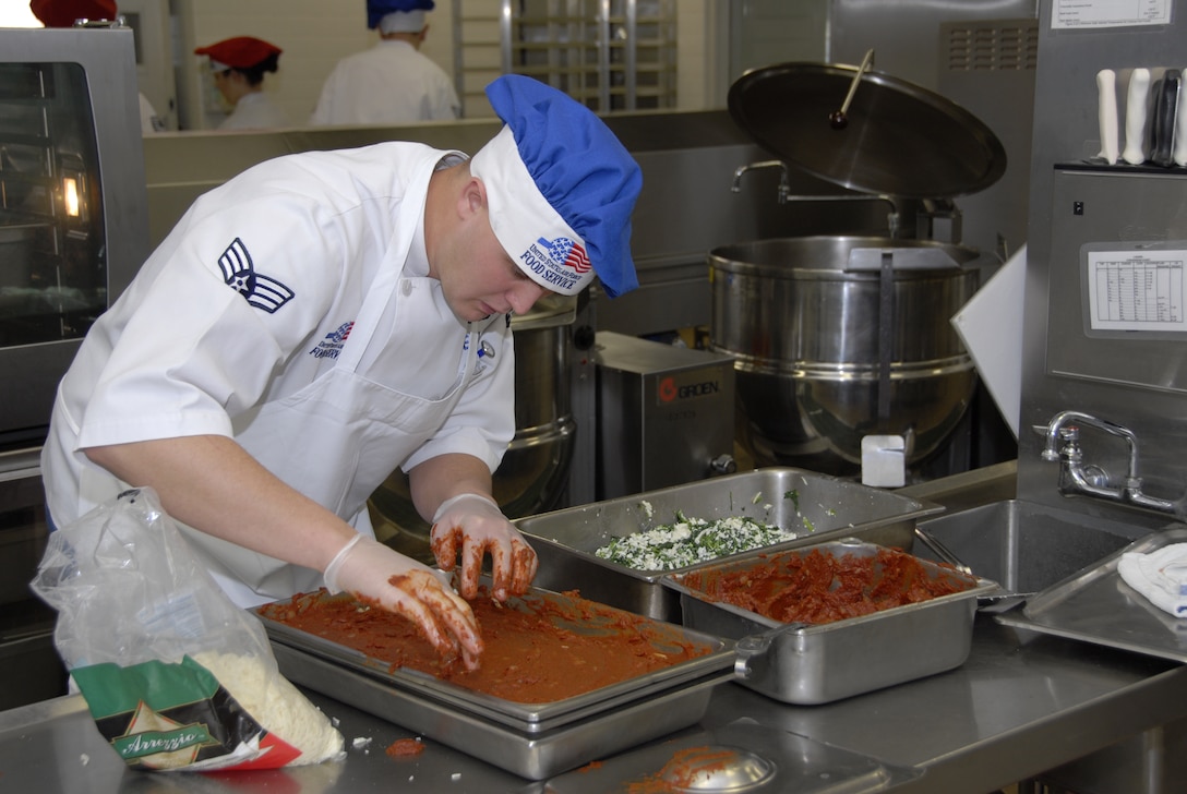 Senior Airman Michael Wellman puts the final touches on a sheet cake at the Nebraska Air National Guard dining facility.The 155th Service Flight, which runs the dining facility, was recently named the 2008 Air National Guard Senior Master Sgt. Kenneth W. Disney Food Service Excellence Award winner. (Photo by Master Sgt. Alan Brown, Nebraska Air National Guard.)