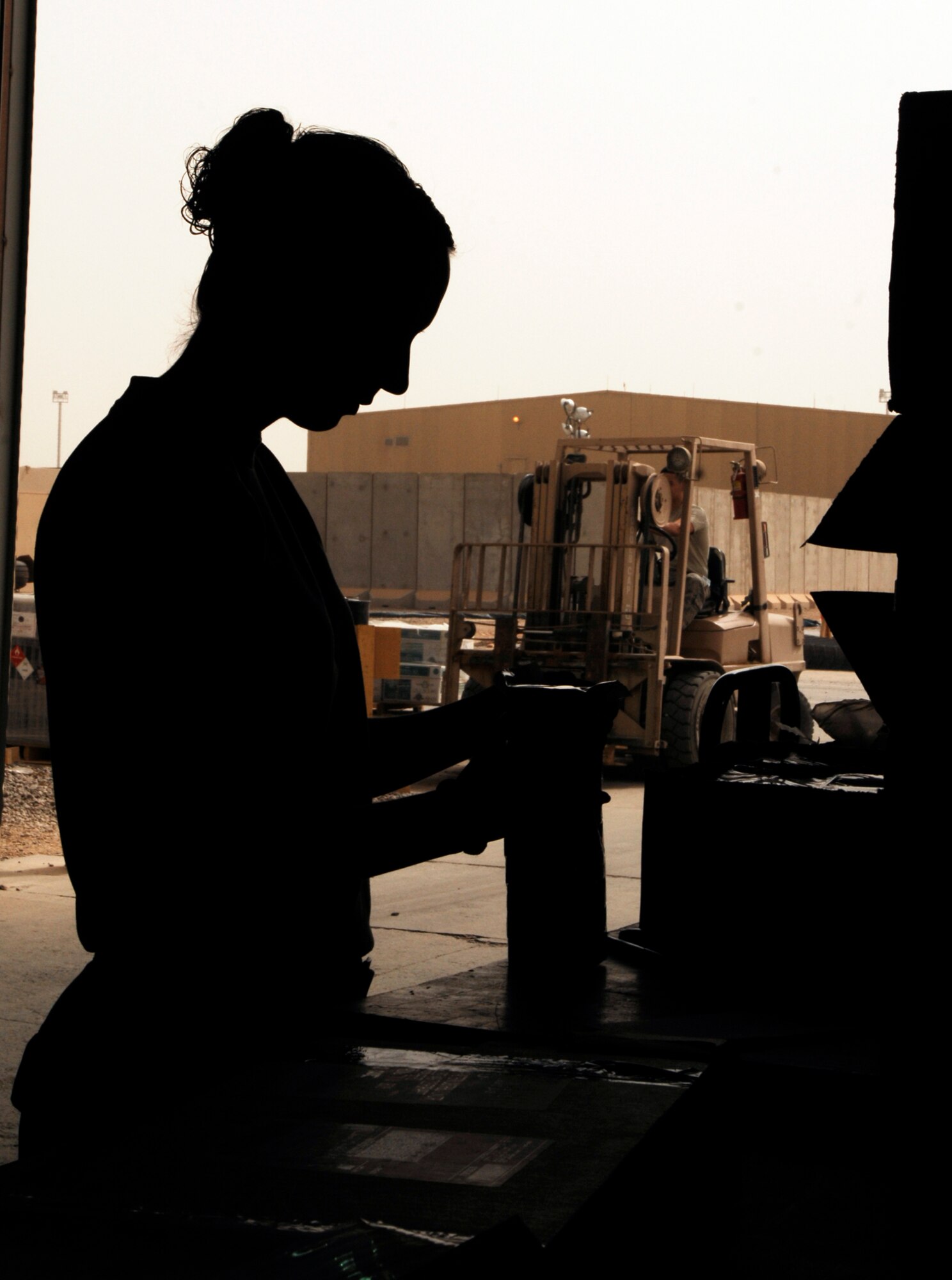 JOINT BASE BALAD, Iraq -- Airman 1st Class Danielle Connelly checks in aircraft parts and supplies here Aug. 5. The 332nd Expeditionary Logistics Readiness Squadron's Receiving Flight Service Center processes approximately 350 aircraft parts a week, including broken parts and replacements, which it then ships to recipients across the base. Airman Connelly, a flight service center journeyman assigned to the 332nd ELRS, is deployed from Davis-Monthan Air Force Base, Ariz. Her hometown is Alamogordo, N.M. (U.S. Air Force photo/Airman 1st Class Jason Epley)