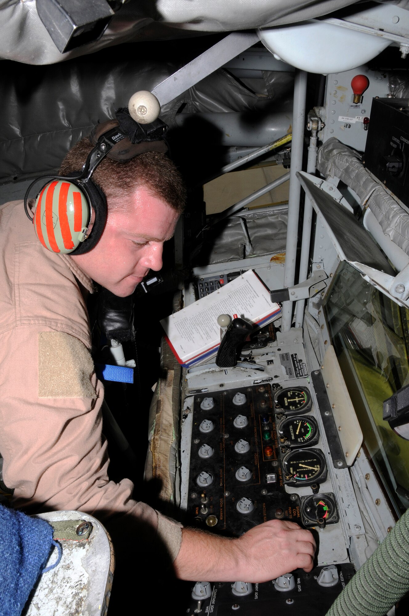 Staff Sgt. David Drain, boom operator, 379th Expeditionary Operations Group, 340th Expeditionary Air Refueling Squadron, goes through his preflight checklist Aug. 6, 2008.  The KC-135 refuelers provide aerial refueling support to Air Force, Navy and Marine Corps and allied nation aircraft engaged in Operations Iraqi Freedom, Enduring Freedom and Joint Task Force Horn of Africa. Sergeant Drain, a native of Chattanooga, Tenn., is deployed from MacDill Air Force Base, Fla. (U.S. Air Force photo by Tech. Sgt. Michael Boquette/RELEASED)