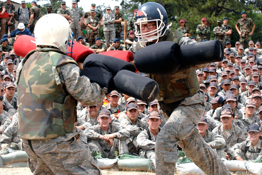 U.S. Air Force Academy basic cadets Bethany Blackburn, right, and Allison Ceranski fight with pugil sticks during the women's Big Bad Basic finals at the U.S. Air Force Academy in Colorado, July 26, 2008. Blackburn won, earning the title "Big Bad Basic."