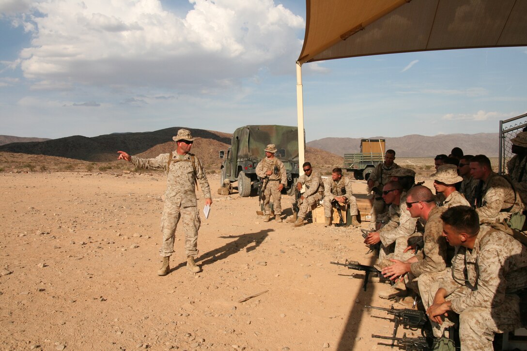 Gunnery Sgt. Rodger Hoke (left) gives a range safety brief at Marine Corps Air Ground Combat Center in Twentynine Palms, Calif., Aug. 7.