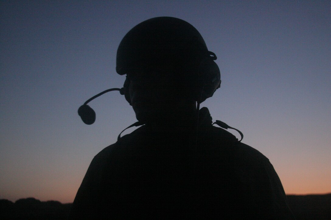 Pfc. Alejandro Sanchez, Amphibian Assault Vehicle crew chief, 3rd Platoon, 3rd AABn, Camp Pendleton, Calif., takes a moment to rest after navigating his amphibian assault vehicle onto the shore of Del Mar Beach, Camp Pendleton, Calif.