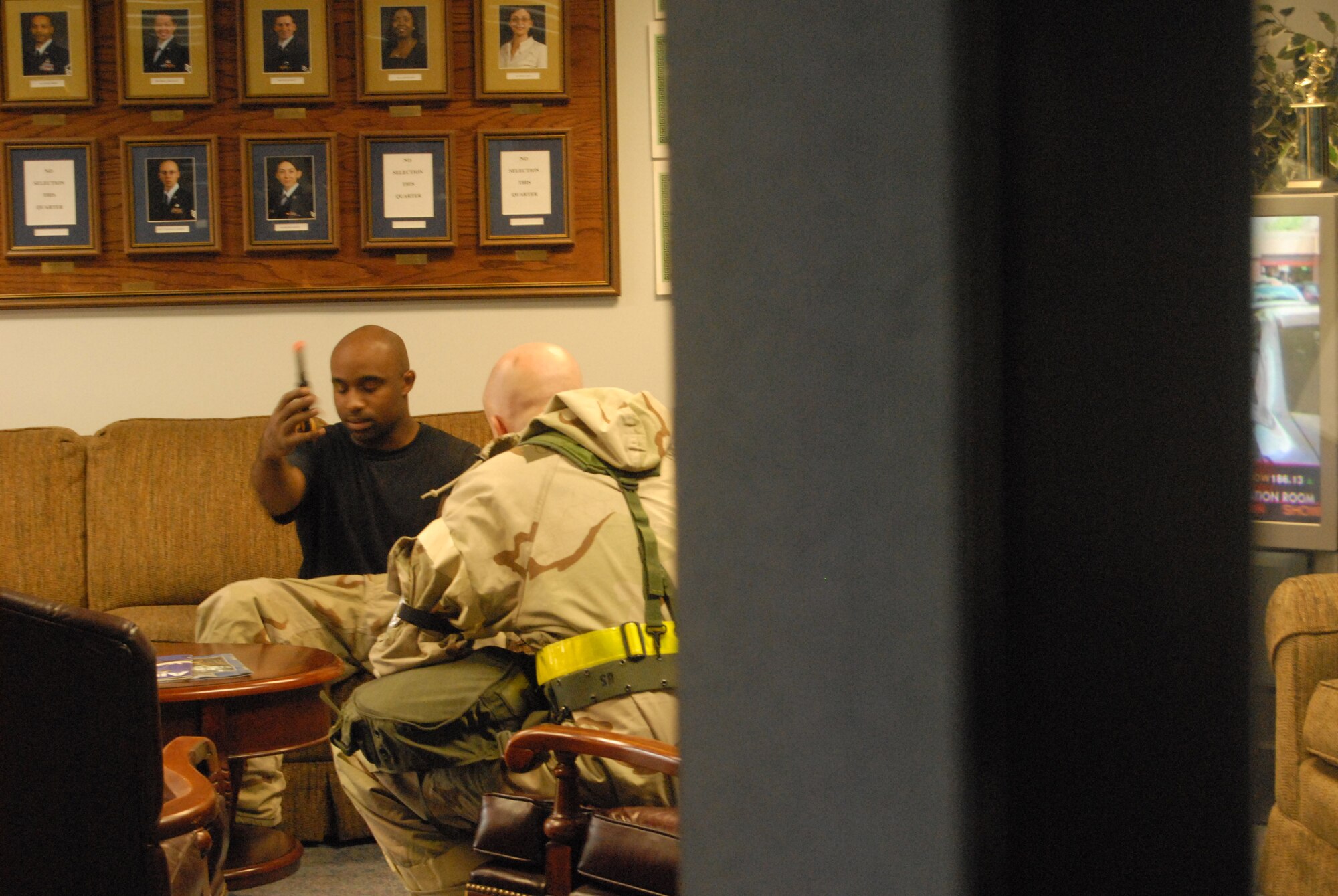 Staff Sgt. Anthony Pounds, 43rd Comptroller Squadron, is talked to by Ch. (Capt.) Jason Botts, 43rd Airlift Wing Chapel, during a "hostage scenario" July 31. Sergeant Pounds and Chaplain Botts were performing roles in the scenario as part of Pope's fourth mobility exercise this year, which have been executed in preparation of an AMC ORI in October. (U.S. Air Force Photo by Senior Airman Jacqueline Pender)