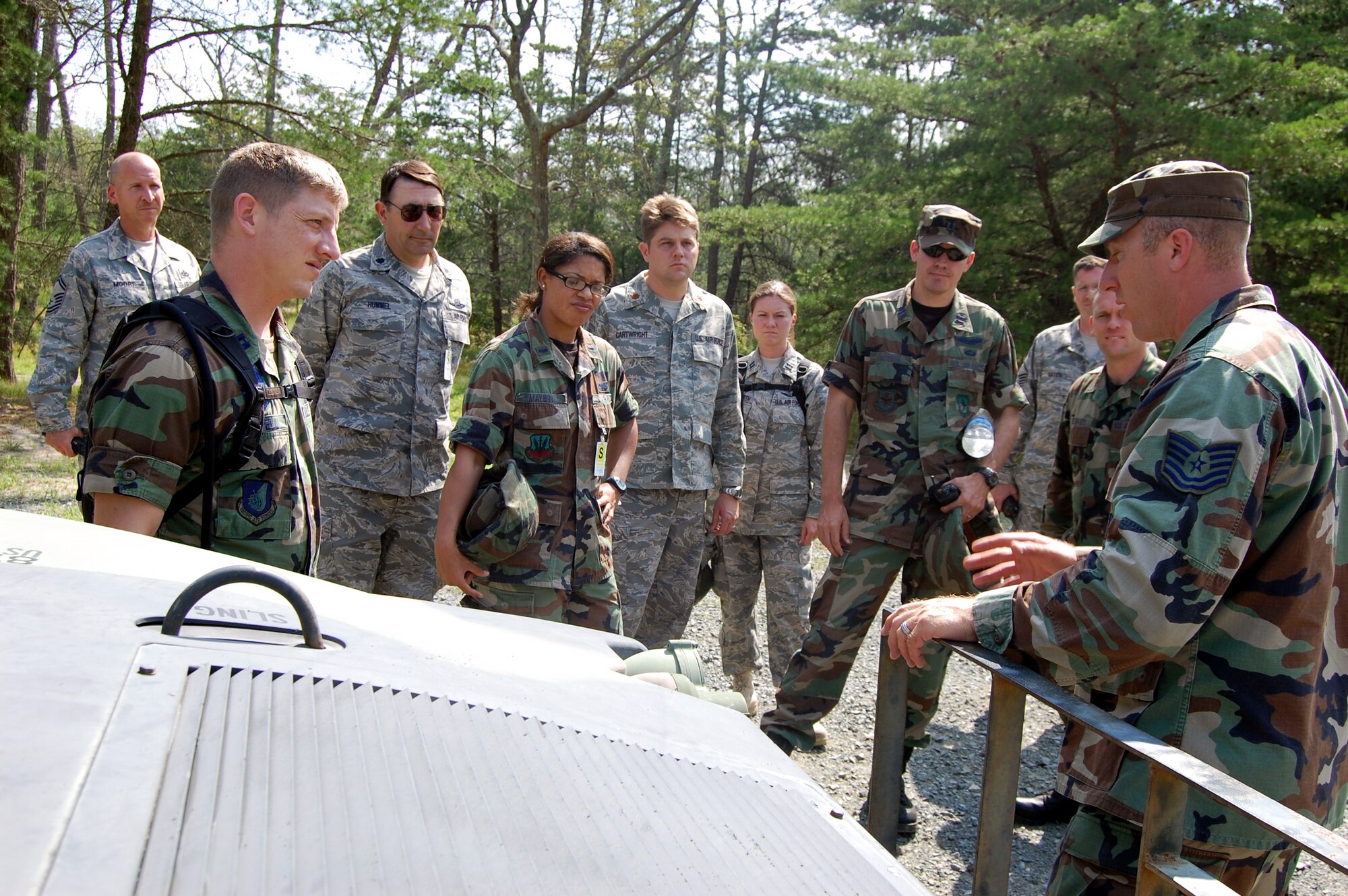 Tech. Sgt. Christopher Leonard, an instructor in the Contingency Response Mission Orientation Course, shows course students some of the functions of a HMMWV on a Fort Dix, N.J., range Aug. 6, 2008, as part of a HMMWV familiarization class.  The CRMOC is taught by the U.S. Air Force Expeditionary Center's Mobility Operations School and trains Airmen who are new to contingency response units.  (U.S. Air Force Photo/Tech. Sgt. Scott T. Sturkol)
