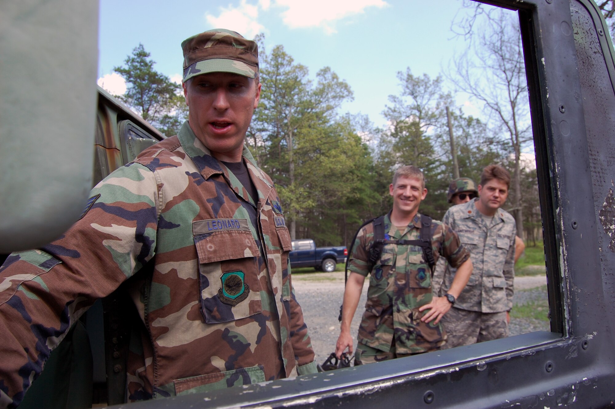 Tech. Sgt. Christopher Leonard, an instructor in the Contingency Response Mission Orientation Course, shows course students some of the functions of a HMMWV on a Fort Dix, N.J., range Aug. 6, 2008, as part of a HMMWV familiarization class.  The CRMOC is taught by the U.S. Air Force Expeditionary Center's Mobility Operations School and trains Airmen who are new to contingency response units.  (U.S. Air Force Photo/Tech. Sgt. Scott T. Sturkol)