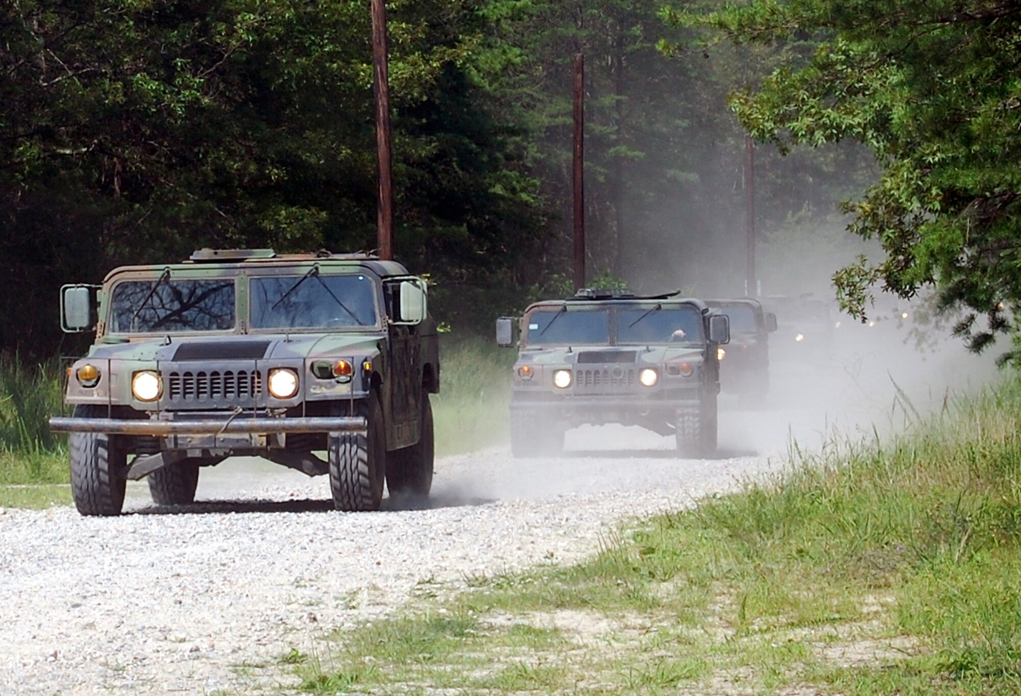 Students in the Contingency Response Mission Orientation Course drive HMMWVs on a Fort Dix, N.J., range Aug. 6, 2008, as part of a HMMWV familiarization class in the course.  The CRMOC is taught by the U.S. Air Force Expeditionary Center's Mobility Operations School and trains Airmen who are new to contingency response units.  (U.S. Air Force Photo/Tech. Sgt. Scott T. Sturkol)