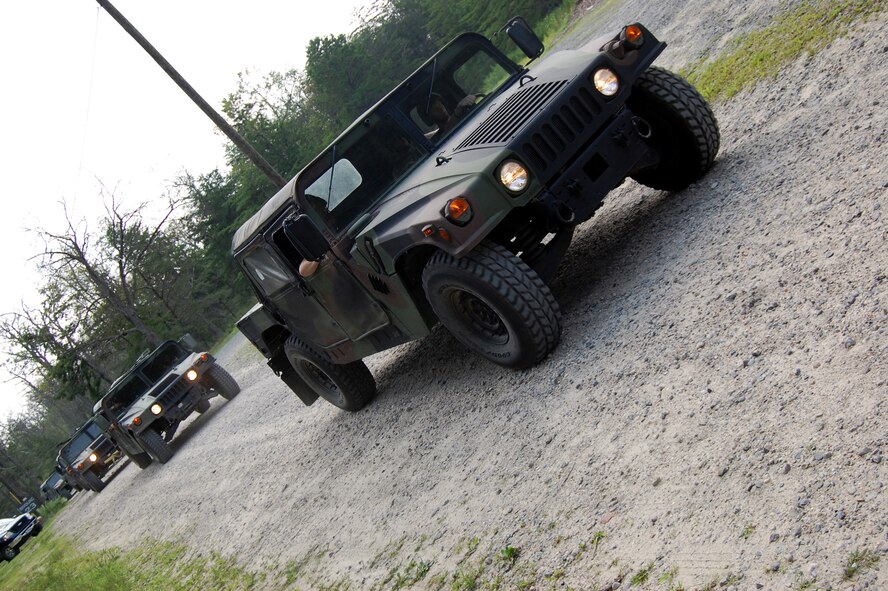 Students in the Contingency Response Mission Orientation Course drive HMMWVs on a Fort Dix, N.J., range Aug. 6, 2008, as part of a HMMWV familiarization class in the course.  The CRMOC is taught by the U.S. Air Force Expeditionary Center's Mobility Operations School and trains Airmen who are new to contingency response units.  (U.S. Air Force Photo/Tech. Sgt. Scott T. Sturkol)