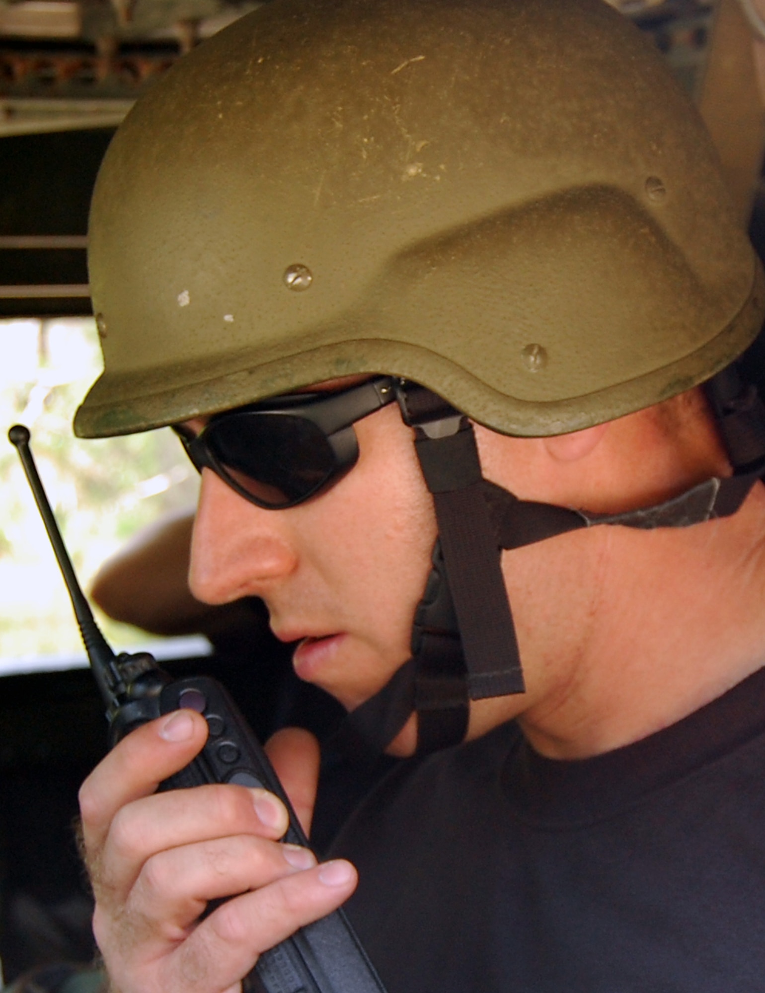 Tech. Sgt. Christopher Leonard, an instructor in the Contingency Response Mission Orientation Course, instructs the course's students over the radio to prepare to roll out in HMMWVs on a Fort Dix, N.J., range Aug. 6, 2008, as part of a HMMWV familiarization class.  The CRMOC is taught by the U.S. Air Force Expeditionary Center's Mobility Operations School and trains Airmen who are new to contingency response units.  (U.S. Air Force Photo/Tech. Sgt. Scott T. Sturkol)