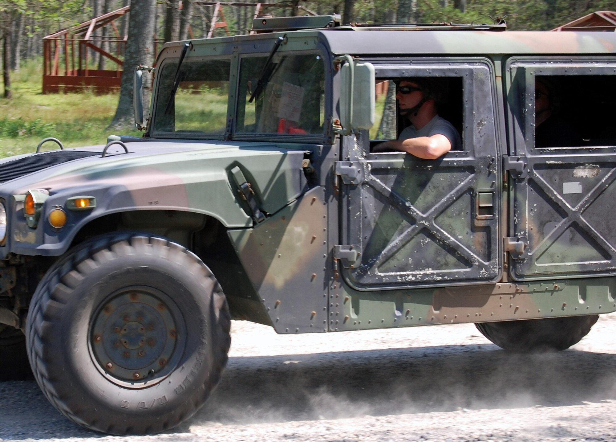 Students in the Contingency Response Mission Orientation Course drive HMMWVs on a Fort Dix, N.J., range Aug. 6, 2008, as part of a HMMWV familiarization class in the course.  The CRMOC is taught by the U.S. Air Force Expeditionary Center's Mobility Operations School and trains Airmen who are new to contingency response units.  (U.S. Air Force Photo/Tech. Sgt. Scott T. Sturkol)