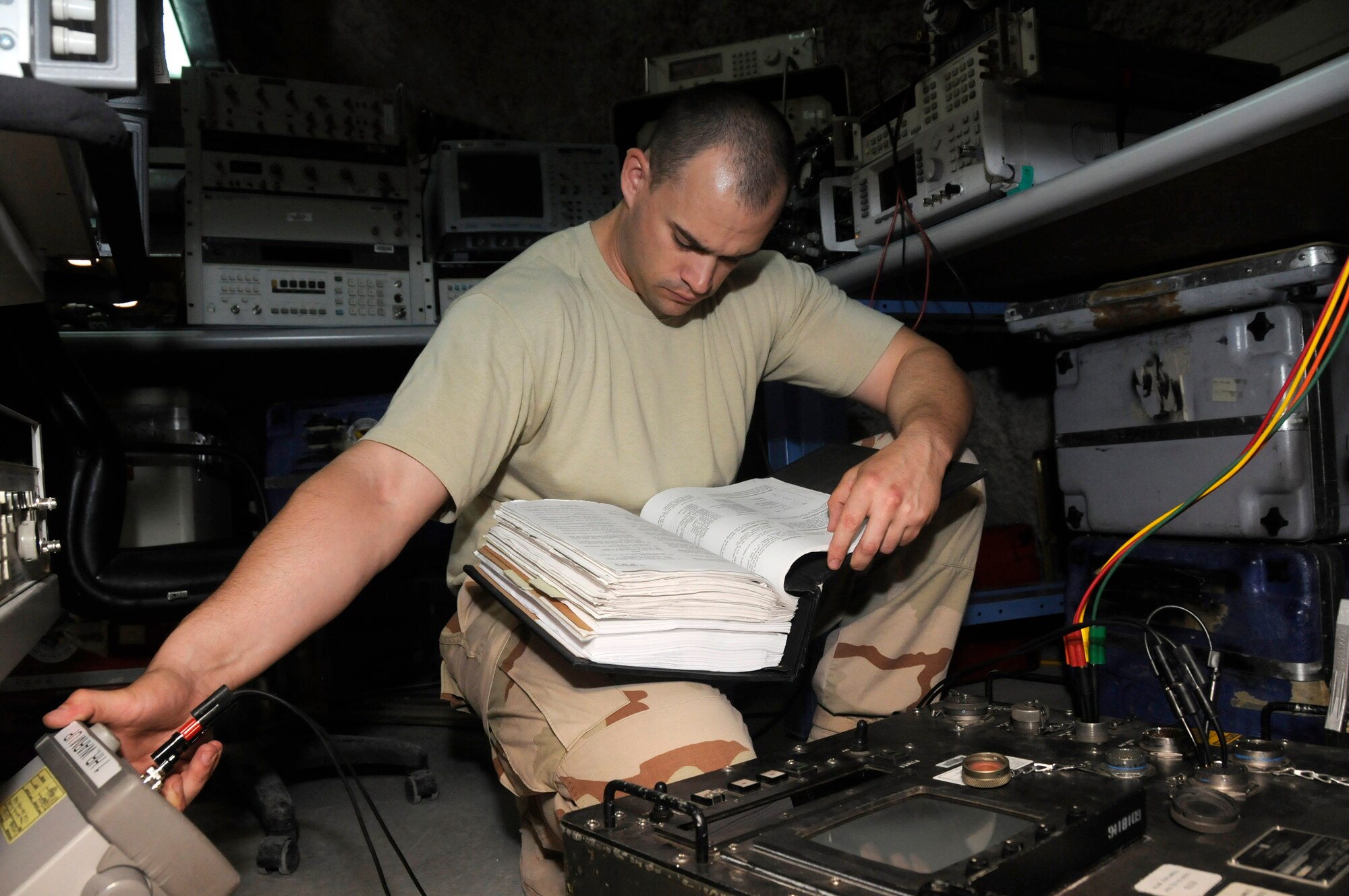 Tech. Sgt. Kevin Clyde calibrates a guided missile test set Aug. 4. Sergeant Clyde is with the 379th Expeditionary Maintenance Squadron's Precision Measurement Equipment Laboratory at an air base in Southwest Asia.  He is deployed from Travis Air Force Base, Calif.  (U.S. Air Force photo/Staff Sgt. Darnell T. Cannady)