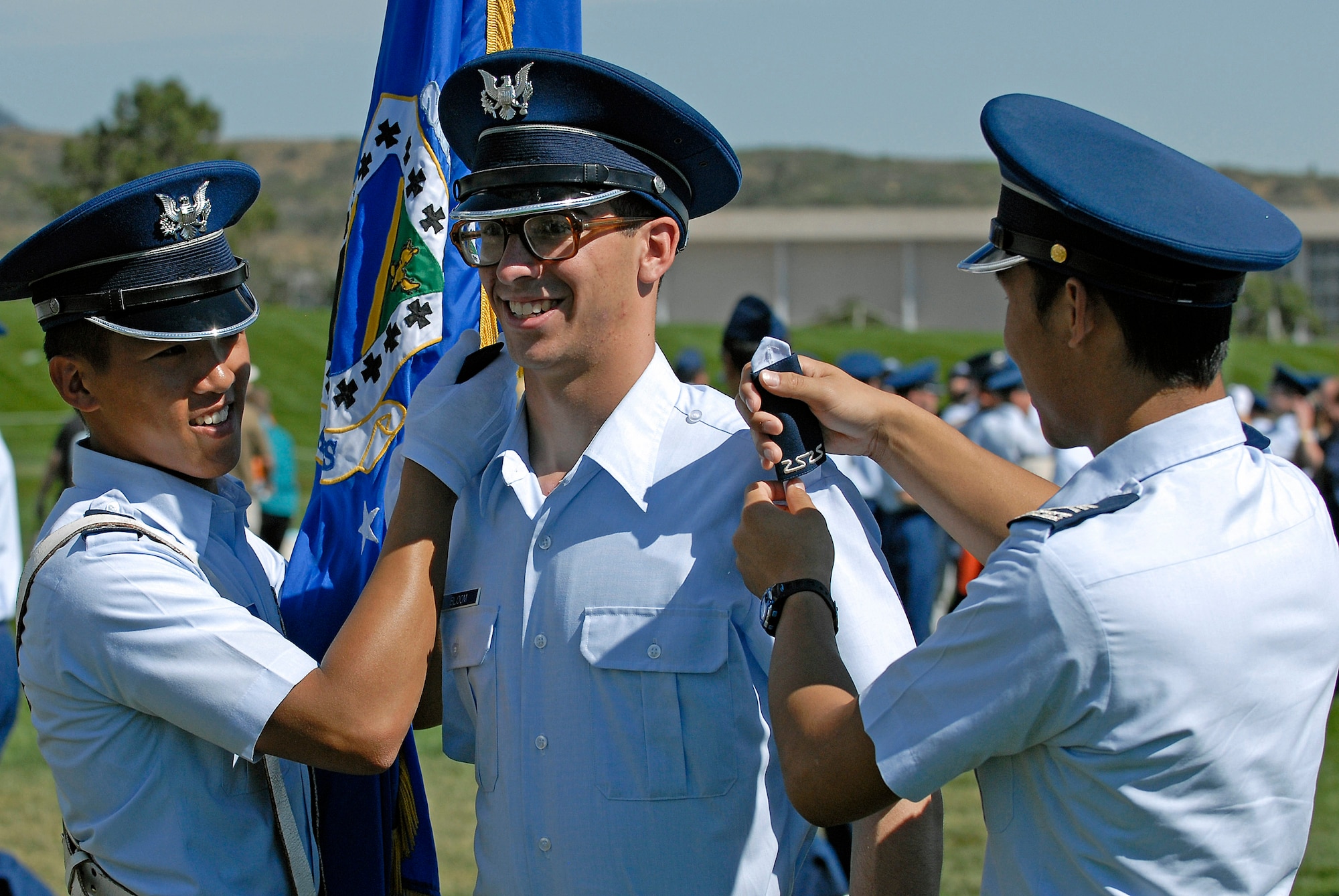 U. S. Air Force Academy Cadet 4th Class Louis Bloom receives his shoulder boards from squadron 38 upper classmen Aug 6 after the Acceptance Day Parade held on the Stillman Parade Feld at the U.S. Air Force Academy in Colorado. (U.S Air Force photo/Mike Kaplan)