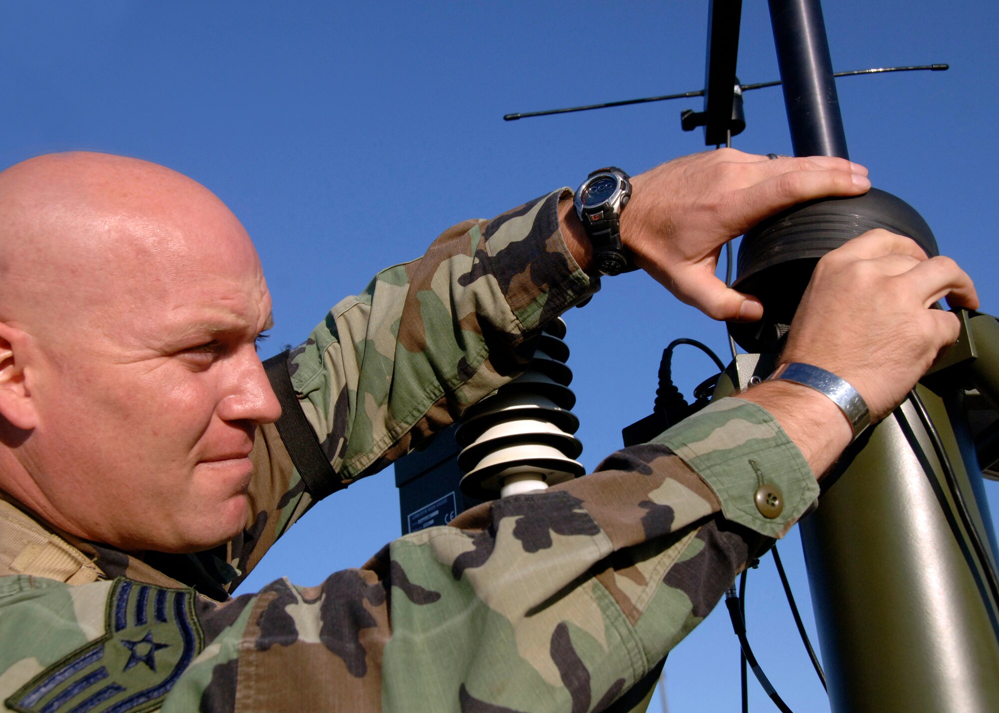 Staff Sgt. Mathew Drew completes a maintenance check on a portable tactical weather system device at a simulated air base in Southeast Asia Aug. 6. The system is used to gather weather data used by aircrew for mission planning.  Sergeant Drew is a weather forecaster with the 437th Operations Support Squadron.  (U.S. Air Force photo/Airman 1st Class Timothy Taylor)

