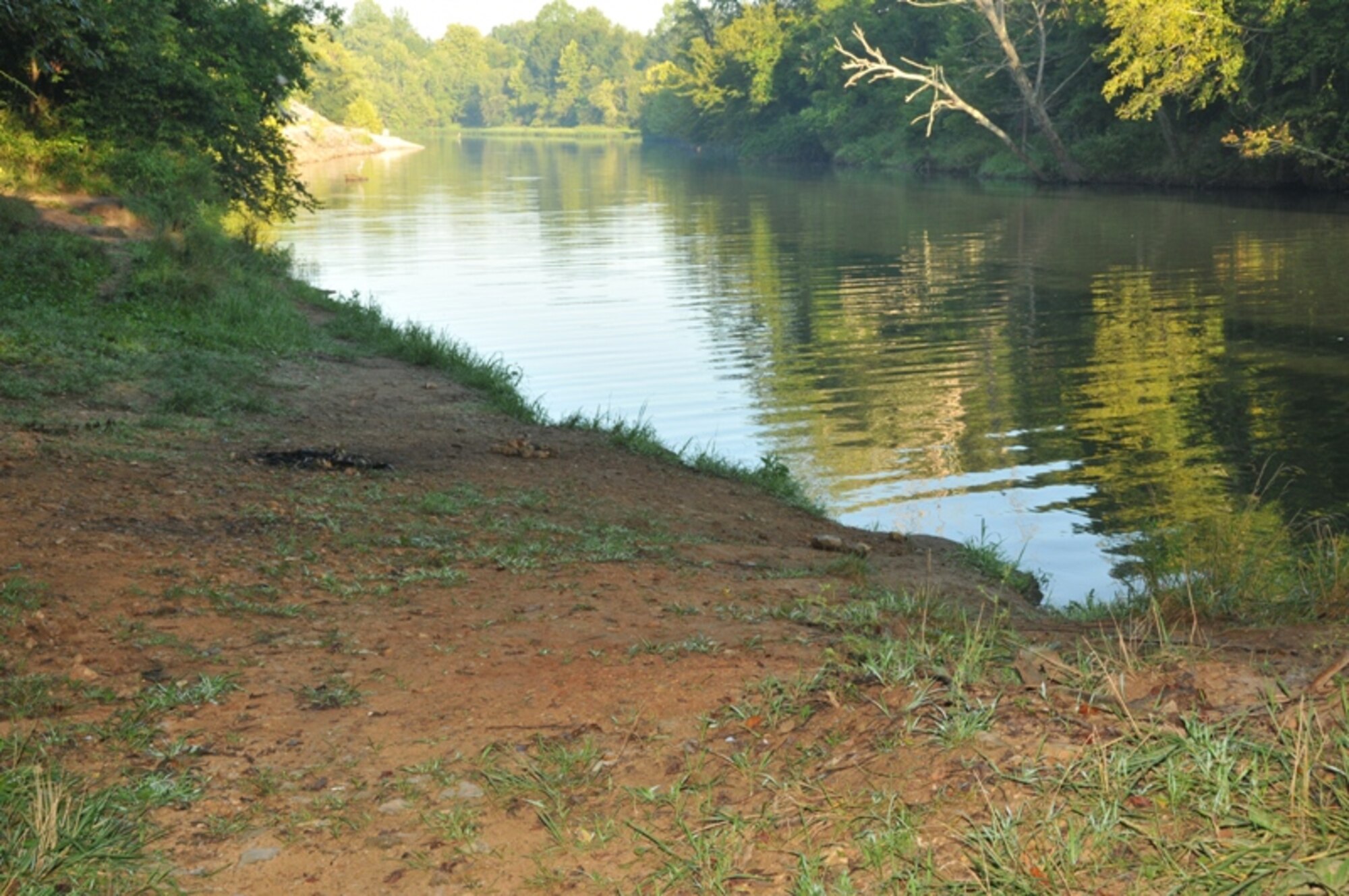 This is the way the area near the Woods Reservoir dam on Arnold Air Force Base appears after base personnel recently removed trash, including discarded furniture, broken glass and plastic bottles that had been illegally left there. Base officials urge people to not litter or illegally dump items on base or risk facing arrest and potential legal action. Also, officials encourage people to report illegal activity to base police at (931) 454-5662. (Photo by David Housch)