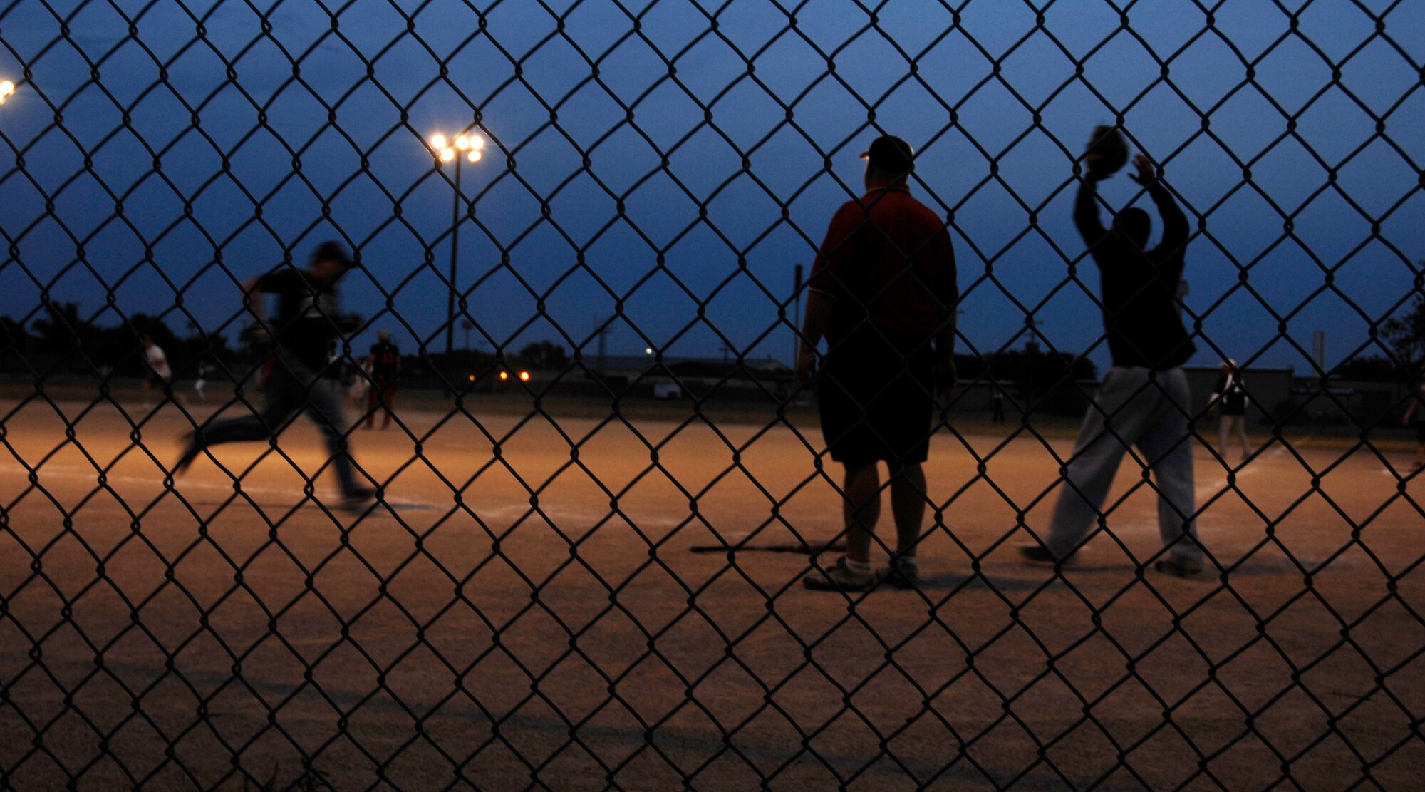 CANNON AIR FORCE BASE, N.M. -- A 27th Special Operations Mission Support Squadron Airman heads for home during a softball game under the lights Aug 7. 27 SOMSS beat the 27th Special Operations Group. (U.S. Air Force photo by Airman 1st Class Evelyn Chavez)