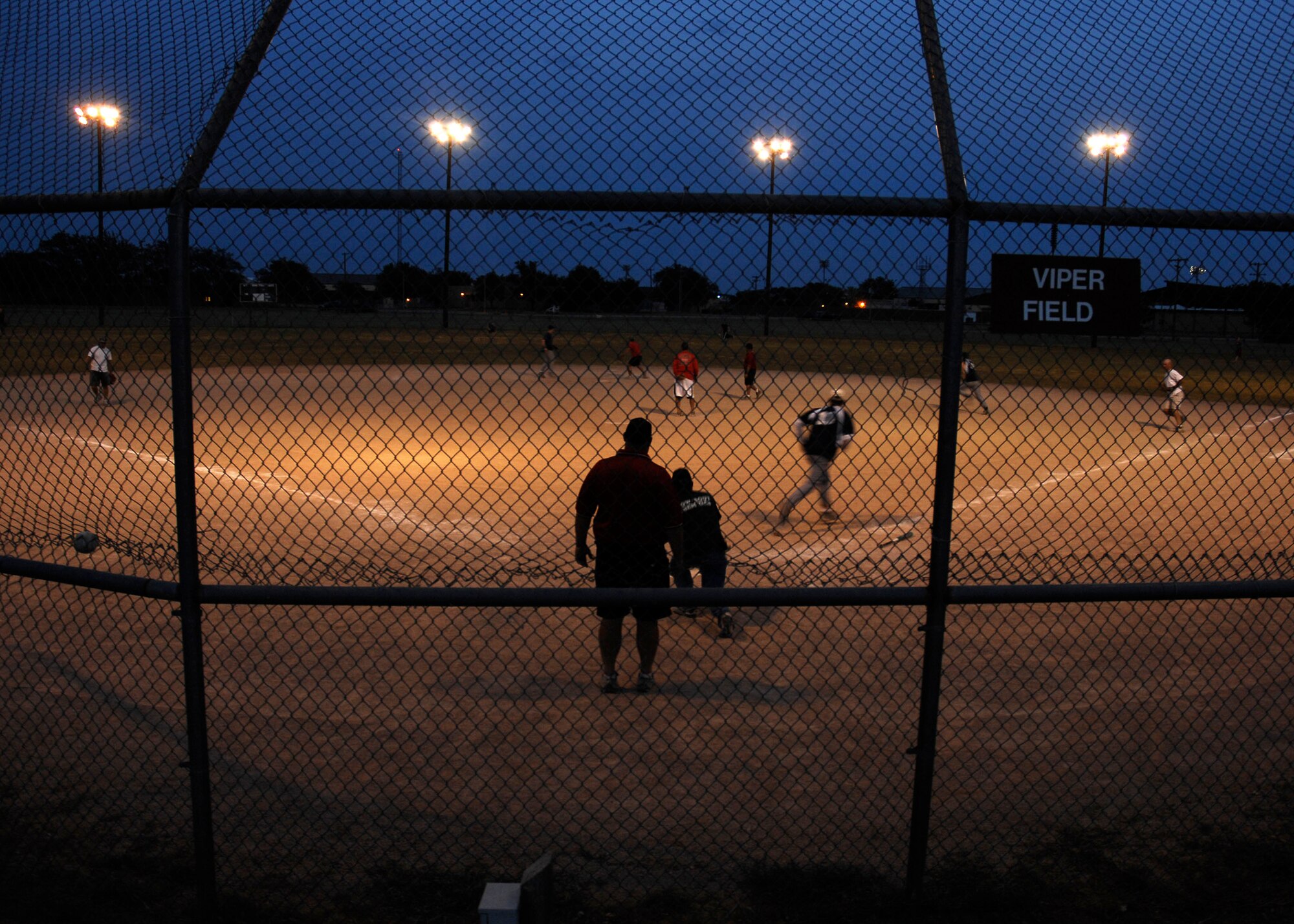 CANNON AIR FORCE BASE, N.M. -- A softball intramural game is played under the lights here  Aug. 7. The season continues through August. (U.S. Air Force photo by Airman 1st Class Evelyn Chavez)
