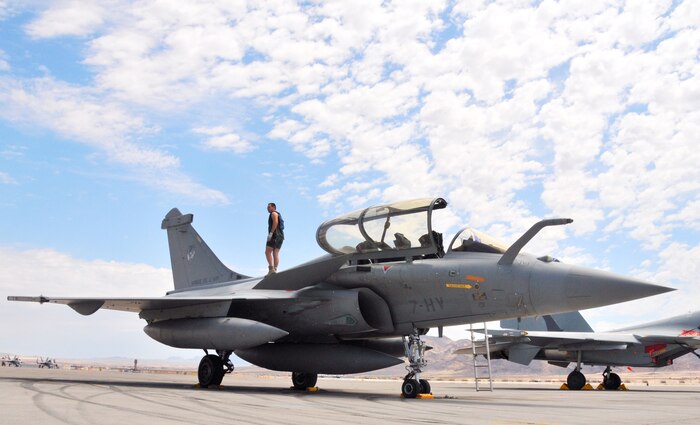 A crewman performs a post-flight check on a French air force Rafale fighter at Nellis Air Force Base, Nev., on Aug. 7.  The French team is at Nellis for Red Flag 08-4, an two-week exercise that pits forces in a realistic aerial "battlefield" to hone the fighting skills of American and allied airmen.   Republic of Korea, Indian, Navy and Air Force teams are joining the French air force in Red Flag 08-4.  (U.S. Air Force photo by Chief Master Sgt. Gary Emery) 