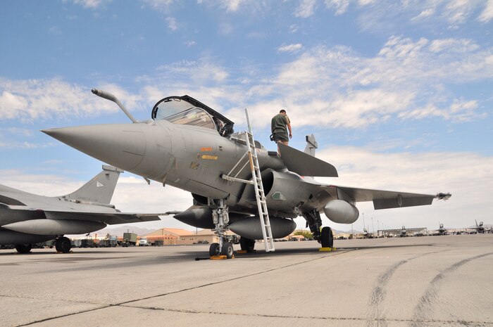 A crewman performs a post-flight check on a French air force Rafale fighter at Nellis Air Force Base, Nev., on Aug. 7.  The French team is at Nellis for Red Flag 08-4, an two-week exercise that pits forces in a realistic aerial "battlefield" to hone the fighting skills of American and allied airmen.   Republic of Korea, Indian, Navy and Air Force teams are joining the French air force in Red Flag 08-4.  (U.S. Air Force photo by Chief Master Sgt. Gary Emery) 