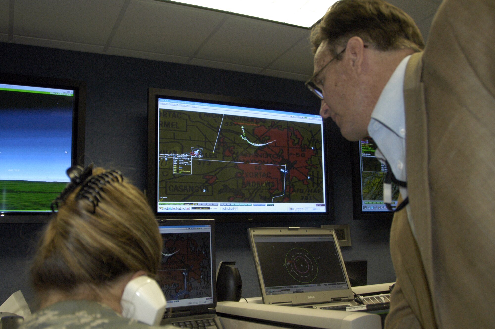 Master Sgt. Angie Wyandt and Mr. Larry Christie work with DMO's networked simulation technology during VIRTUAL FLAG at Tyndall AFB.  DMO is competing for the 2008 Chief of Staff Team Excellence Award.                 