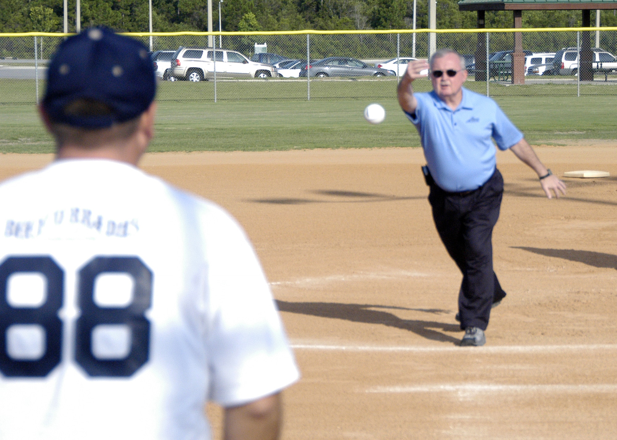 Chief Master Sgt. Richard Smith, Command Chief of the Air National Guard, threw out the first pitch of day kicking off this years 43rd Annual Air National Guard Softball Tournament. (Air Force photo by 1st Lt Jared Scott)        