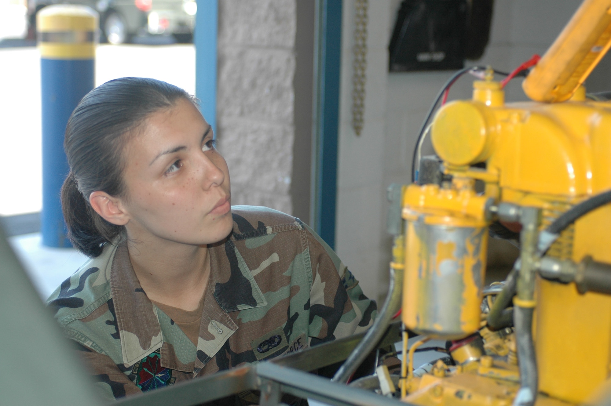 Airman 1st Class Ana Canillas, AGE technician troubleshoots the starter and electronic systems on a MJ-1B bomb lift to ensure it is getting enough voltage to start the engine. The unit was in the shop for a yearly and special inspection when problems were discovered with the starter and lift cylinders. (Air National Guard photo by Staff Sgt. Jordan Jones.)