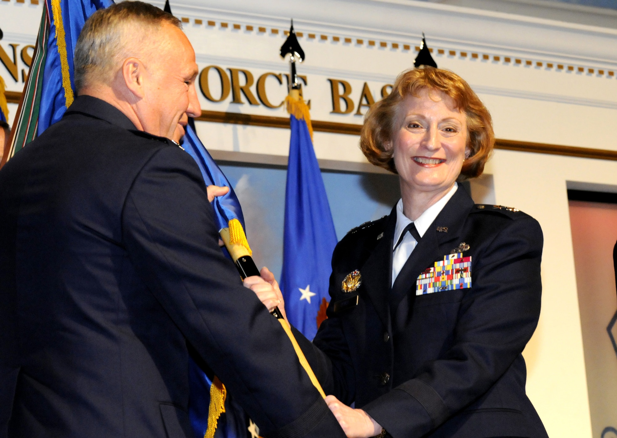Maj. Gen. Polly A. Peyer took command of the Warner Robins Air Logistics Center Aug. 7 during a ceremony at the Century of Flight Hangar at the Museum of Aviation.  She said she was excited to be taking command of the Center and looked forward to what the future has in store. "This is the job I always aspired to have," she said. "This for me is the epitome of what I set out to do." 
Gen. Bruce Carlson, commander of Air Force Materiel Command, presided over the ceremony.  General Carlson assured those in attendance the Center is in "solid and great hands.” He added, "I assure you Polly Peyer comes to you with the highest credentials as both a maintenance officer and a logistician." 
General Peyer came to Robins from Headquarters U.S. Air Force where she was director of resource integration in the Office of the Deputy Chief of Staff for Logistics Installations and Mission Support.  U.S. Air Force photo by Sue Sapp 
