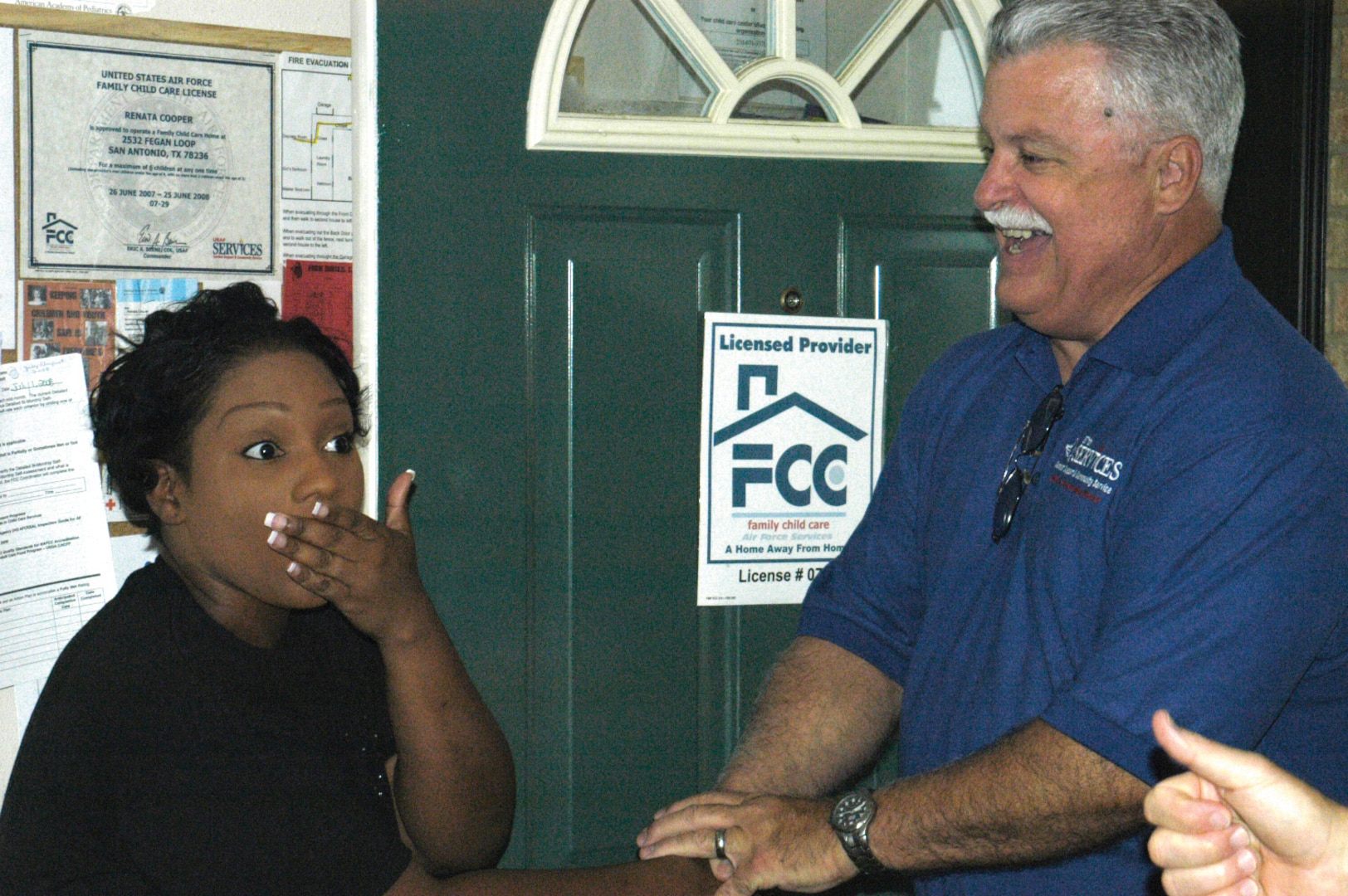 8/4/2008 - Chief of Services Jerry Stanfill congratulates Renata Cooper for being named Air Education and Training Command's Family Child Care provider of the year. (USAF photo by Meredith Canales)
                                