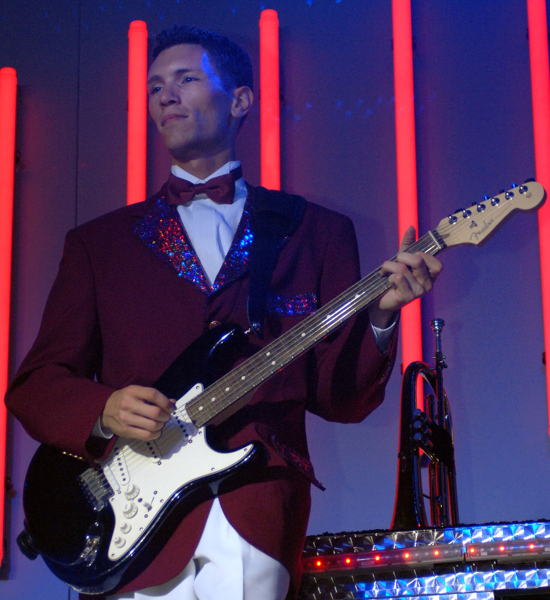 Senior Airman David Leatherwood, a guitarist on the tour, plays to a medley of country hits. Airman Leatherwood is stationed here at RAF Mildenhall and is assigned to the 727th Air Mobility Squadron. (U.S. Air Force photo by Staff Sgt. Tyrona Pearsal)