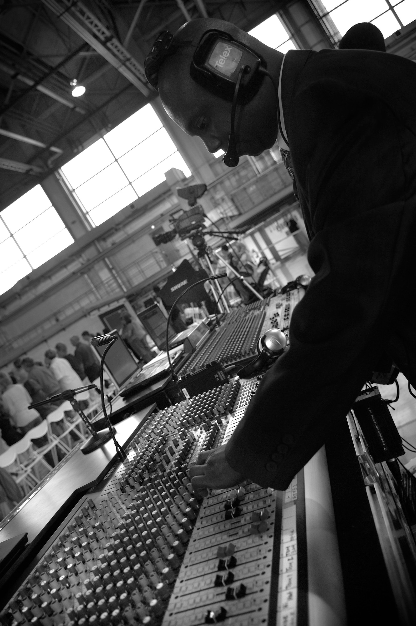 The show would not be a success without sound of course. Tech. Sgt. Otis Samuels, II, 30th Space Communications Squadron, Vandenberg Air Force Base, tests the sound equipment before the show begins. Sergeant Samuels is the technical director on the tour. It is his responsibility to make sure the talent presented by Tops In Blue is not only seen but heard. (U.S. Air Force photo by Staff Sgt. Tyrona Pearsal)