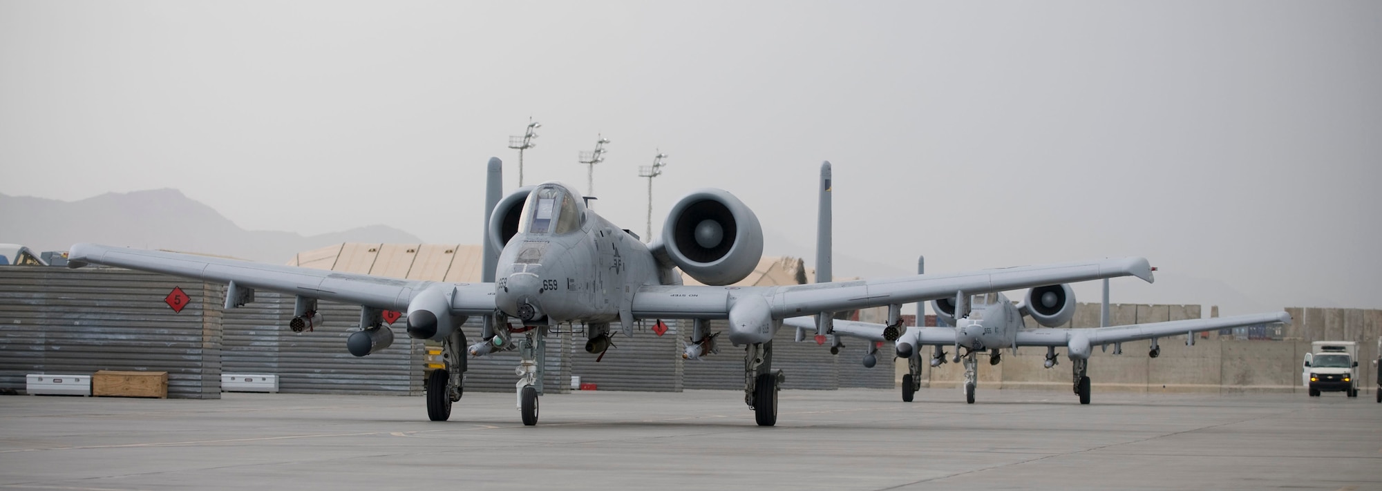 BAGRAM AIR FIELD, Afghanistan -- Two A-10 Thunderbolt II jets taxi out to the runway here on July 26, 2008. The jets are experts at close air support missions and have proven to be invaluable despite being well past their expected useful lifespan. (U.S. Air Force photo by Staff Sgt. Samuel Morse)