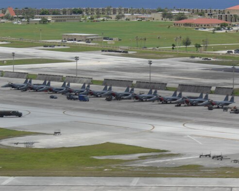 ANDERSEN AIR FORCE BASE, Guam - Air Force F-15s occupy the flightline here July 28. The aircraft, deployed from Mountain Home AFB, Idaho, are here to promote regional security and stability through three main focus areas: a continuous forward presence; a robust international exercise and training program; and significant joint military training exercises.  By maintaining a continuous forward presence and conducting joint exercises, the Pacific Air Force is able to foster improved relations and interoperability with its regional friends and allies. (U.S. Air Force photo by Airman 1st Class Cory Todd)
