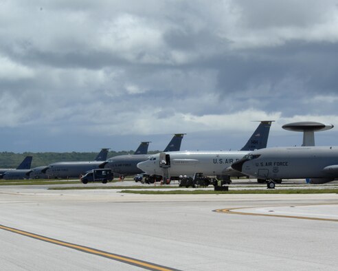 ANDERSEN AIR FORCE BASE, Guam - Air Force fighters, bombers, tankers and air control aircraft occupy the flightline here July 28. The aircraft, deployed from several Air Force bases, are here to promote regional security and stability through three main focus areas: a continuous forward presence; a robust international exercise and training program; and significant joint military training exercises.  By maintaining a continuous forward presence and conducting joint exercises, the Pacific Air Force is able to foster improved relations and interoperability with its regional friends and allies. (U.S. Air Force photo by Airman 1St Class Cory Todd)