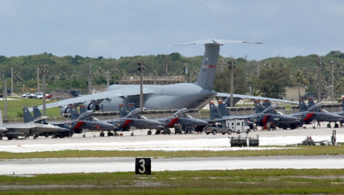 ANDERSEN AIR FORCE BASE, Guam - Air Force fighters and cargo aircraft occupy the flightline here July 29. The aircraft, deployed from several Air Force bases, are here to promote regional security and stability through three main focus areas: a continuous forward presence; a robust international exercise and training program; and significant joint military training exercises.  By maintaining a continuous forward presence and conducting joint exercises, the Pacific Air Force is able to foster improved relations and interoperability with its regional friends and allies. (U.S. Air Force photo by Airman 1St Class Cory Todd)