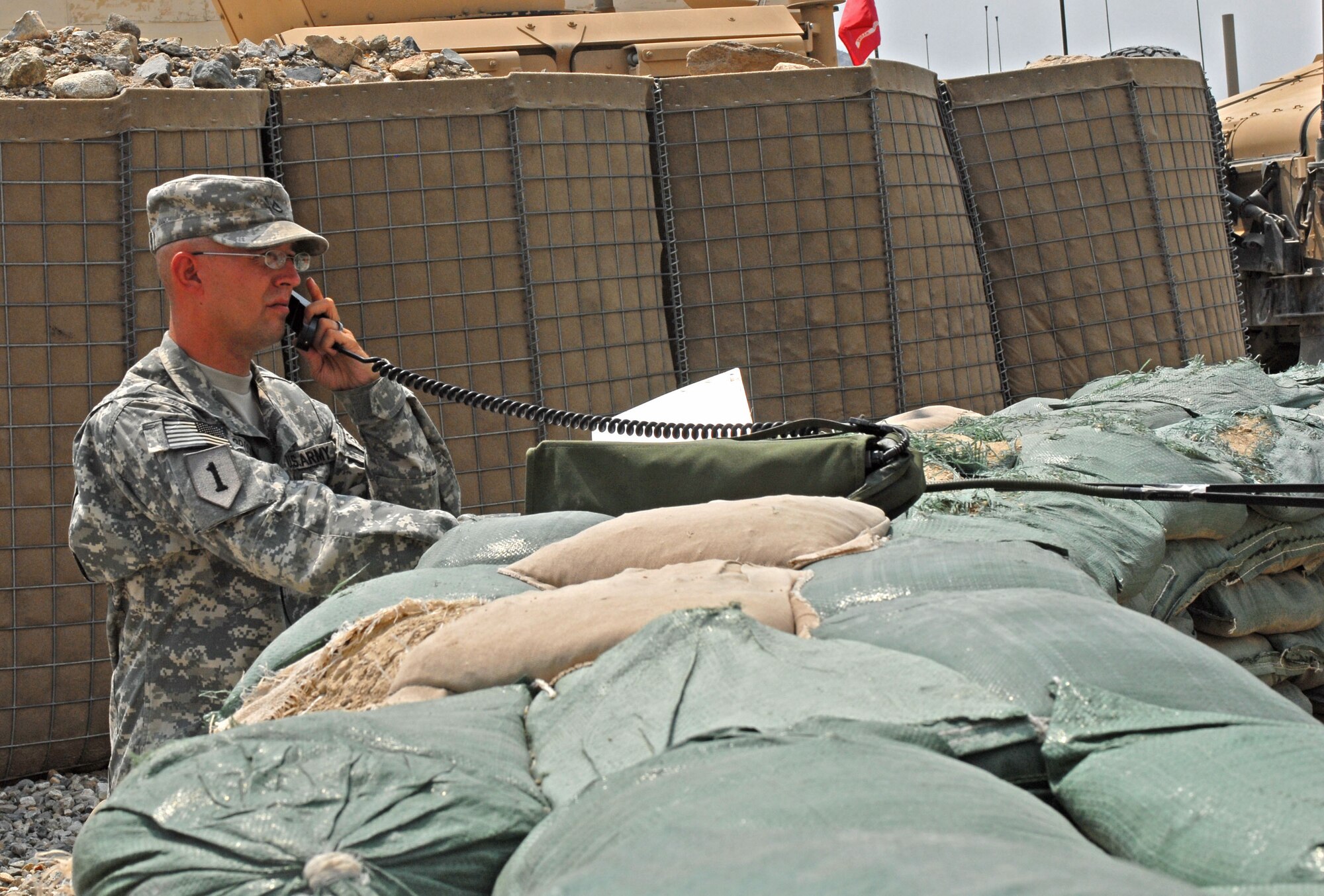 Army Pfc. Thomas Brooks gets mission information from the Joint Operations Center, Forward Operating Base Kala Gush, Afghanistan, July 30. (U.S. Army photo/ Staff Sgt. Adora Medina)
