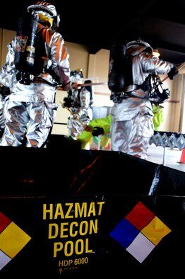 ANDERSEN AIR FORCE BASE, Guam- Members of the Andersen Fire and Emergency Services conduct a hazardous material exercise at Andersen's Fire Station One Aug. 6. Teams from 36th Civil Engineer Squadron's emergency management flight and the 36th Medical Group's bioenvironmental element also participated in the HAZMAT exercise. (U.S. Air Force photo by Airman 1st Class Courtney Witt)