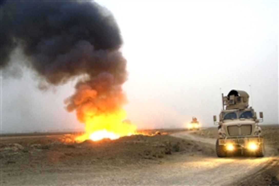 U.S. soldiers conduct a mounted patrol in Mine Resistant Ambush Protected Vehicles after setting canal vegetation ablaze in Tahwilla, Iraq, July 30, 2008. The soldiers are assigned to the 1st Armored Division's 1st Battalion, 2nd Brigade Combat Team. Extremists use the concealment of the  intricate canal system and its vegetation to lay bombs at night. 