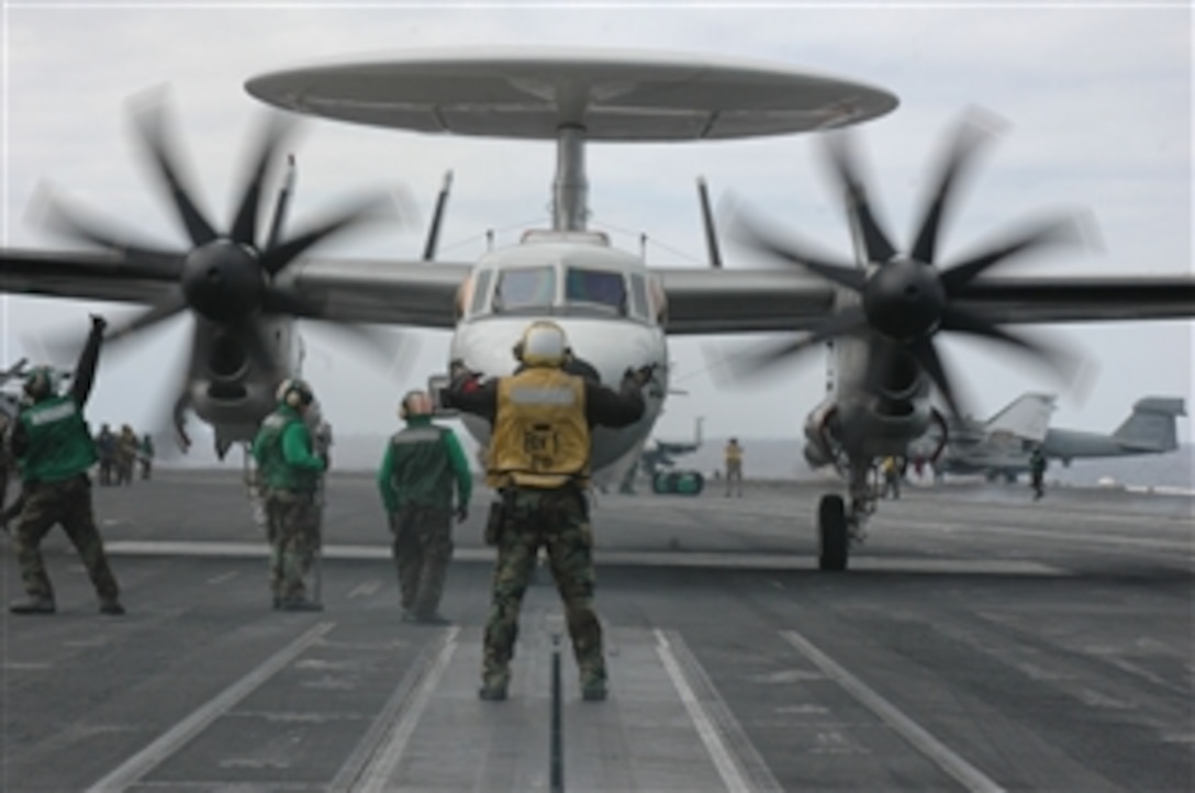An E-2C Hawkeye aircraft assigned to Carrier Airborne Early Warning Squadron 115 approaches a catapult prior to its final launch from the flight deck of the USS Kitty Hawk (CV 63) while underway in the Pacific Ocean on Aug. 6, 2008.  More than 900 U.S. sailors from the ship and its air wing will transfer to the USS George Washington (CVN 73) upon the Kitty Hawk's arrival in San Diego, Calif.  The Kitty Hawk, which is returning to the U.S. to be decommissioned, is being replaced in Yokosuka, Japan, by the nuclear-powered aircraft carrier USS George Washington (CVN 73).  