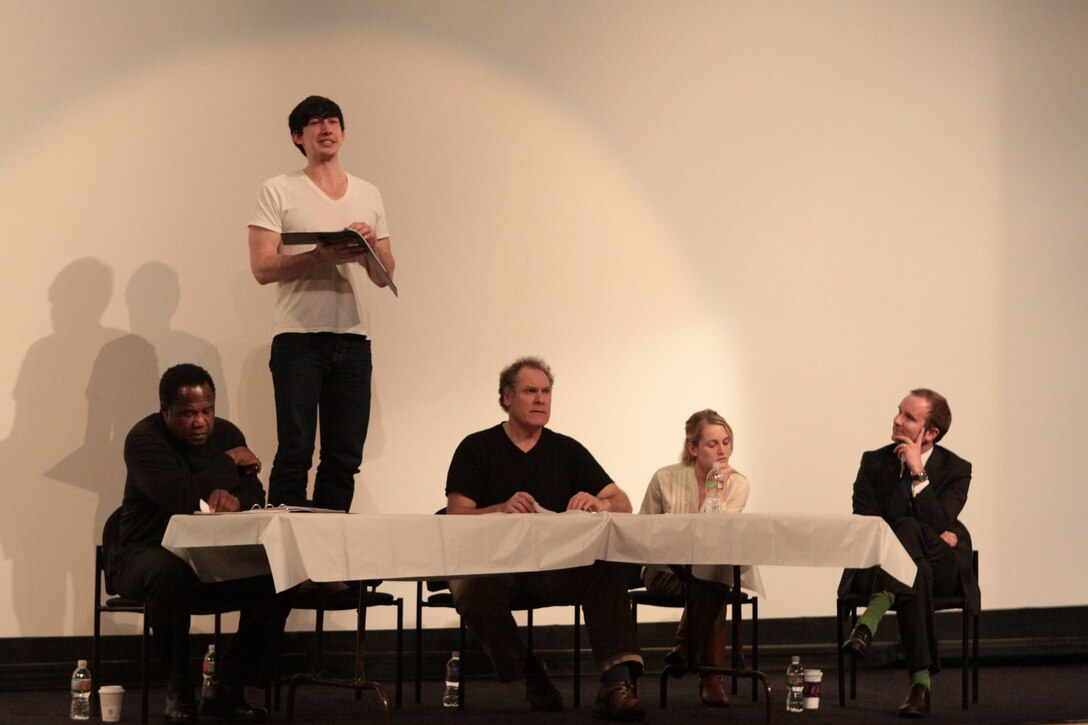 Adam Driver, actor, amongst co-stars Isiah Whitlock Jr., Jay O. Sanders and Joanne Tucker during the performance of "Theater of War" at the Camp Pendleton base theater, Feb. 6. The goal of the play is to create  awareness of combat  related injuries and for service members to understand it is better to seek help than ignore the symptoms.