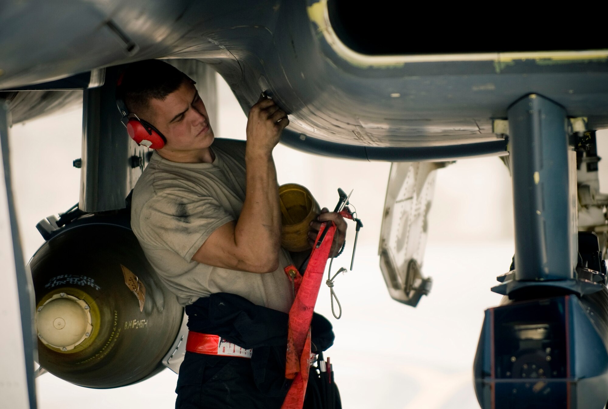 BAGRAM AIR FIELD, Afghanistan -- Airman 1st Class Justin Mirante, 494th Expeditionary Aircraft Maintenance Unit crew chief, assists in powering down an F-15E Strike Eagle here on August 1, 2008. The aircraft must be powered down carefully to ensure safety and to keep wear and tear on engine components to a minimum. Airman Mirante is deployed from the 494th Aircraft Maintenance Unit, RAF Lakenheath, England. (U.S. Air Force photo by Staff Sgt. Samuel Morse)