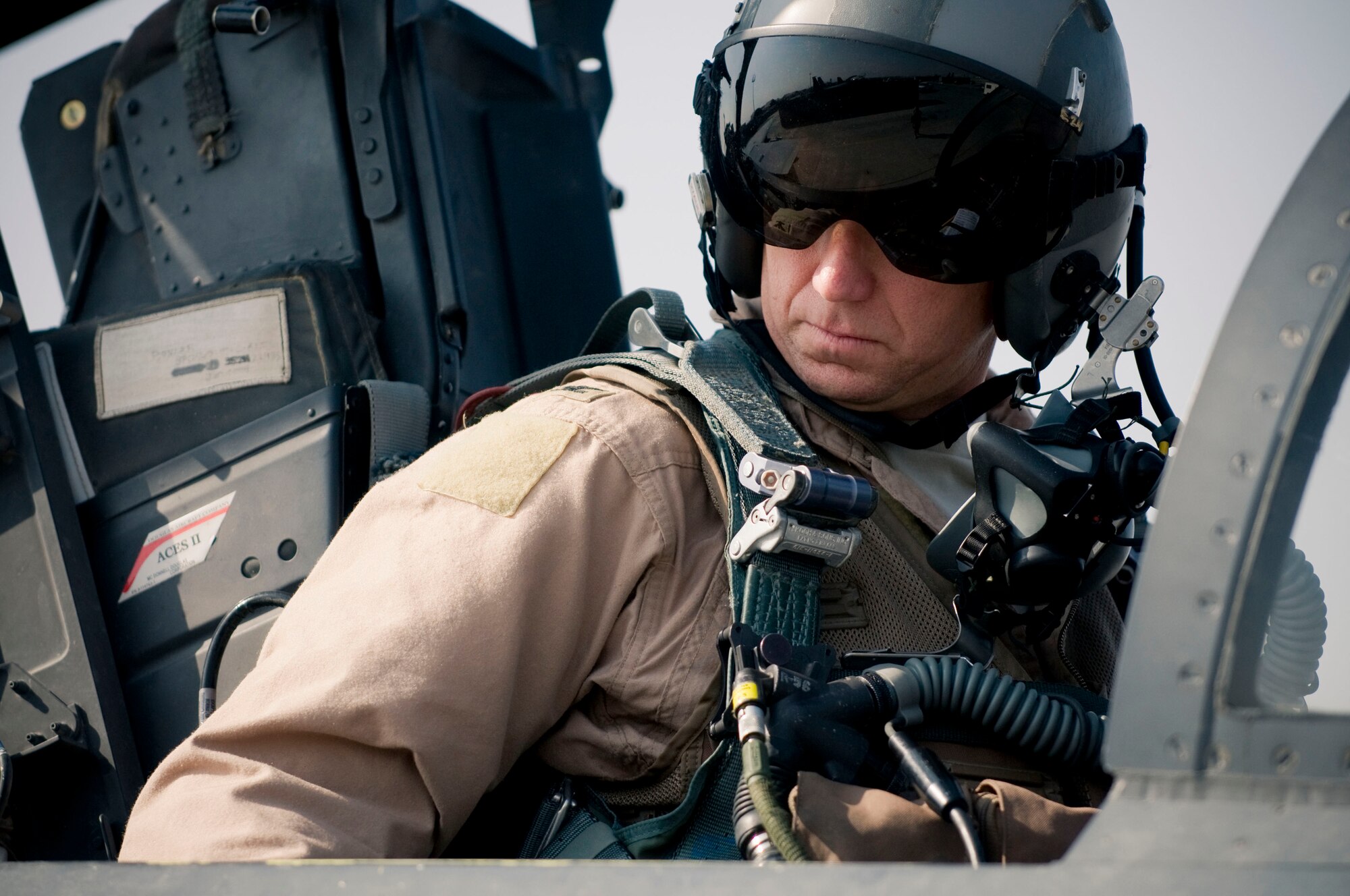 BAGRAM AIR FIELD, Afghanistan -- Col. Mark Kelly, 455th Air Expeditionary Wing vice commander checks his instruments in the cockpit of an F-15E Strike Eagle here on August 1, 2008. To maintain flight certification, Colonel Kelly must fly periodically to prove proficiency. Colonel Kelly is deployed from Mountain Home Air Force Base, Idaho. (U.S. Air Force photo by Staff Sgt. Samuel Morse)