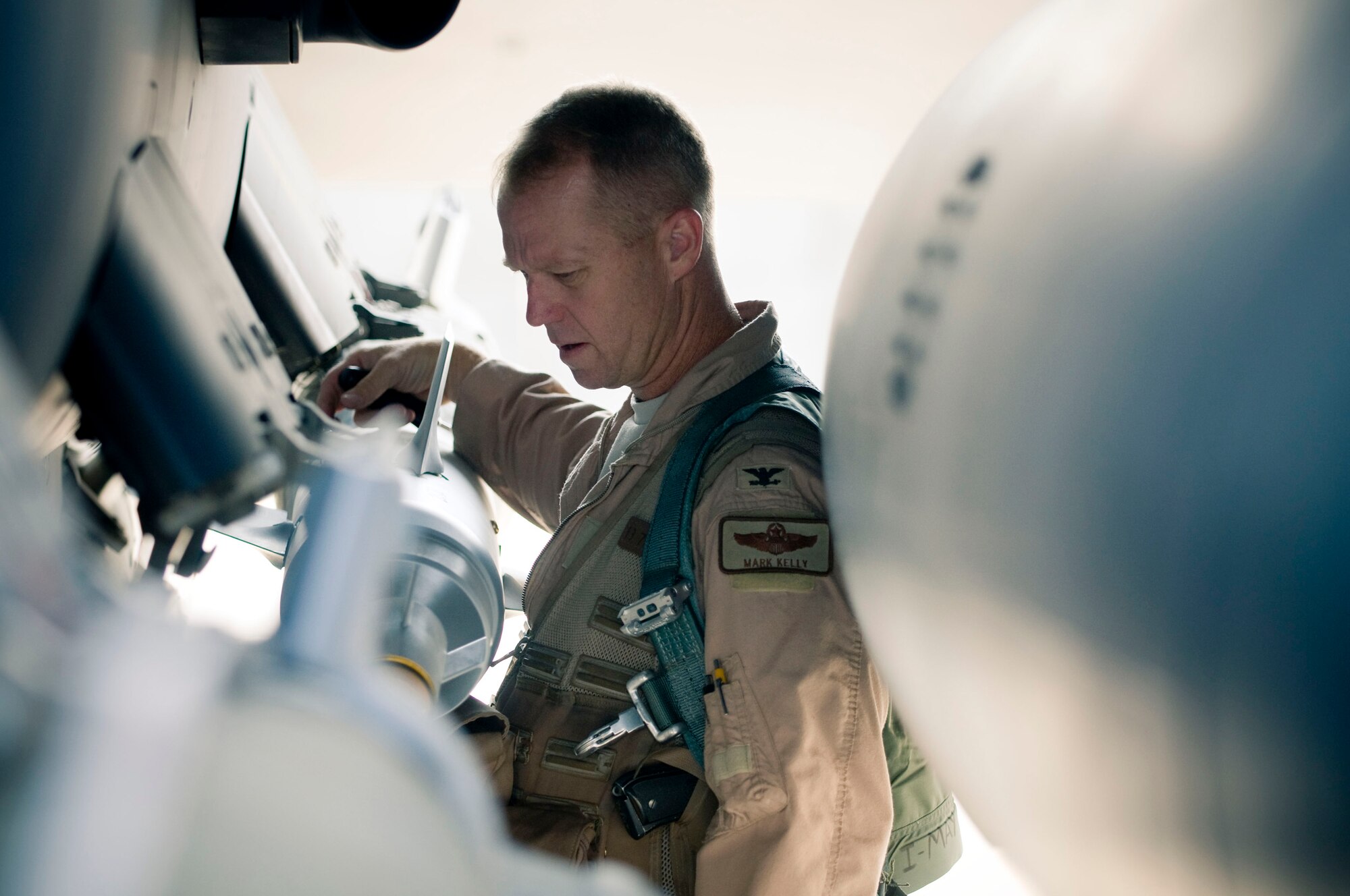 BAGRAM AIR FIELD, Afghanistan -- Col. Mark Kelly, 455th Air Expeditionary Wing vice commander, performs preflight checks on the ordinance on his F-15E Strike Eagle here on August 1, 2008. Extensive preflight checks help to prevent potential mishaps during flight. Colonel Kelly is deployed from Mountain Home Air Force Base, Idaho. (U.S. Air Force photo by Staff Sgt. Samuel Morse)